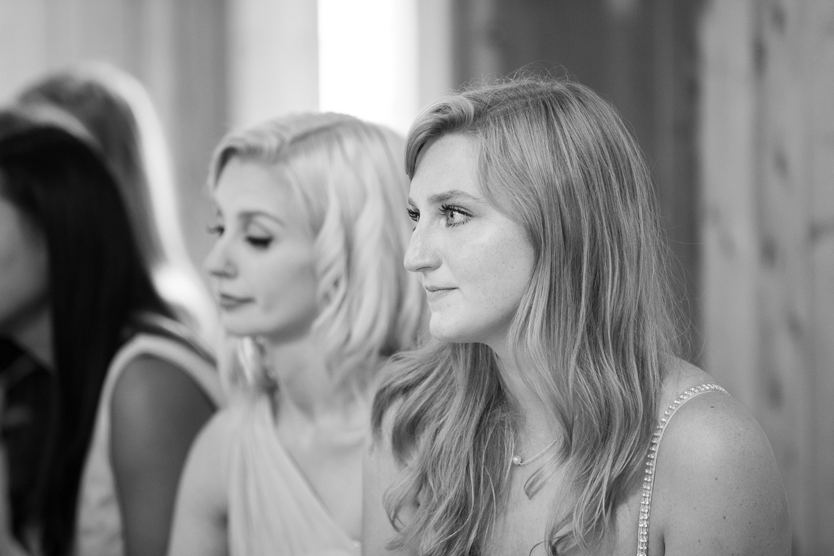 Bridesmaid crying during first dance at wedding reception