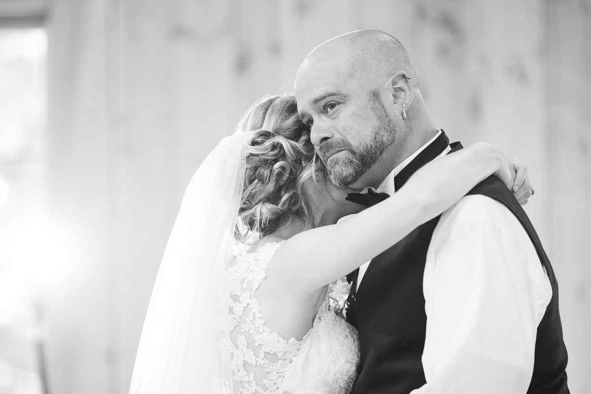 Black and white photo of father daughter dance. 