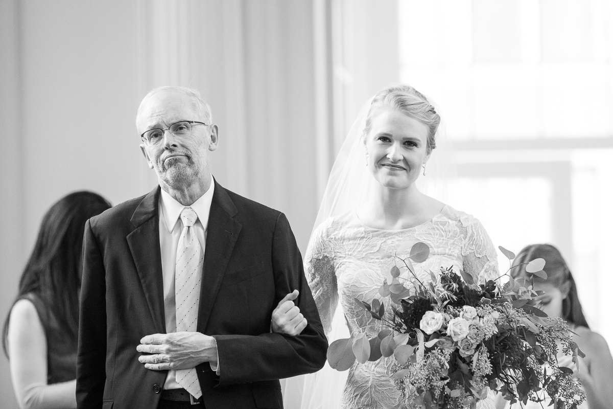 Bride walking down the aisle with her dad.