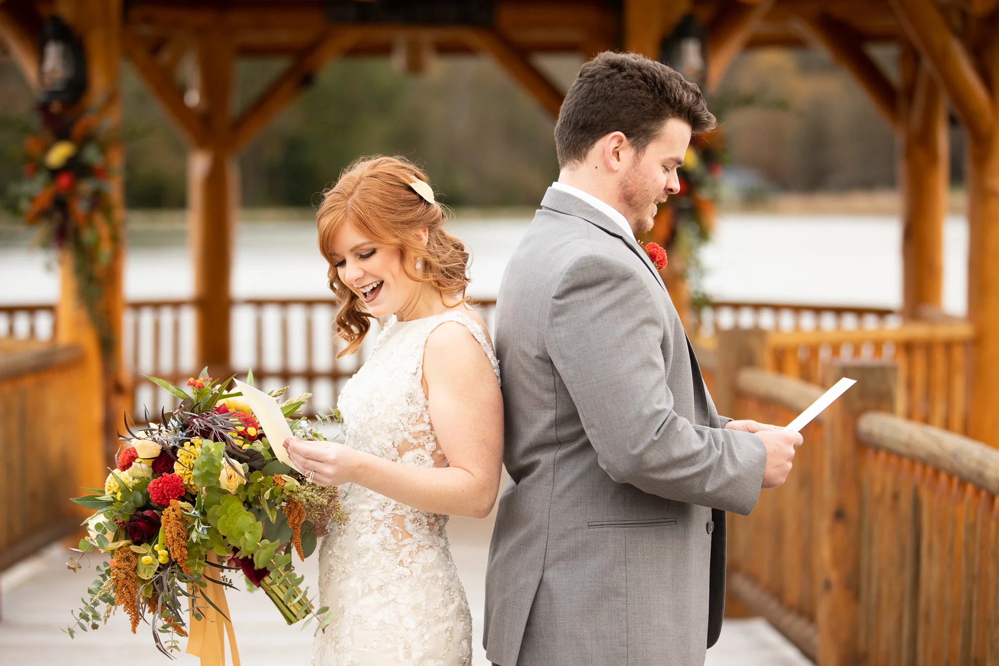 Bride and groom exchanging Wood & Grace love letters at autumn styled shoot.