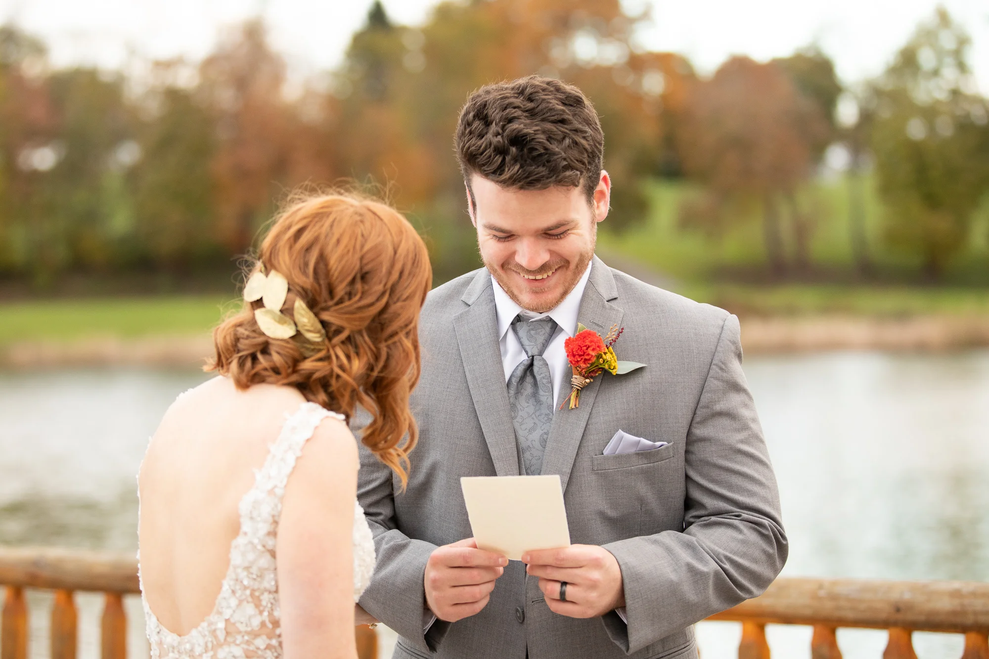 Bride and groom reading wedding vows at autumn styled shoot.