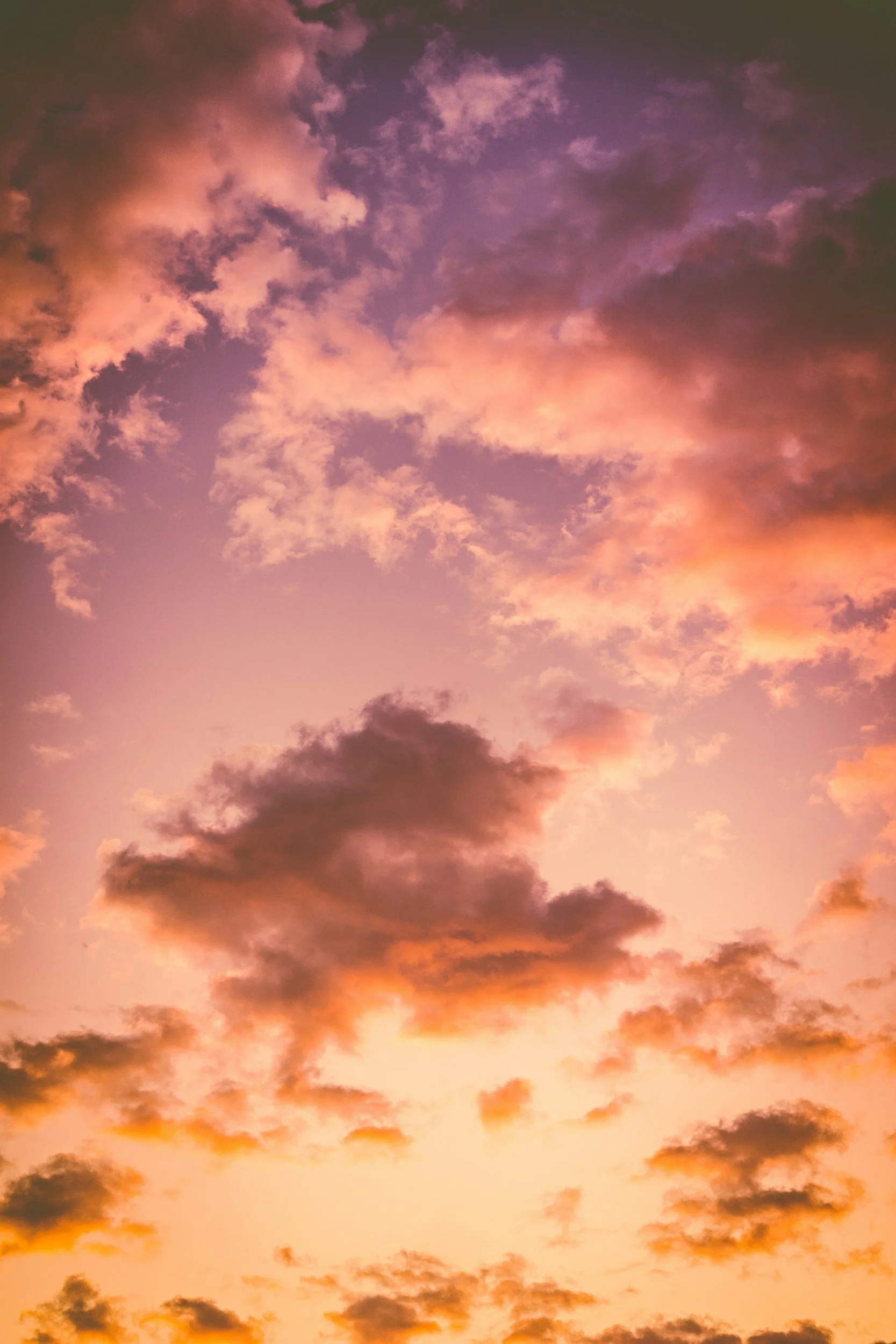 Sunset sky with pink, purple, and orange clouds.