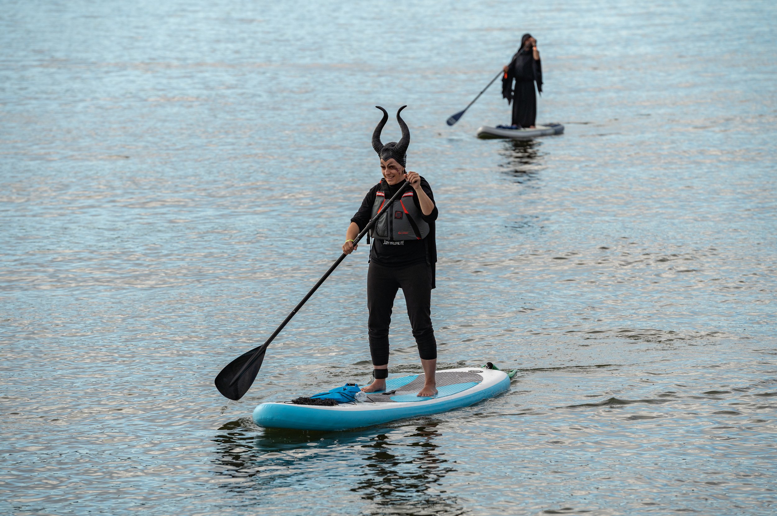Paddle Boarders in Witch Costumes Welcome Halloween - The New York