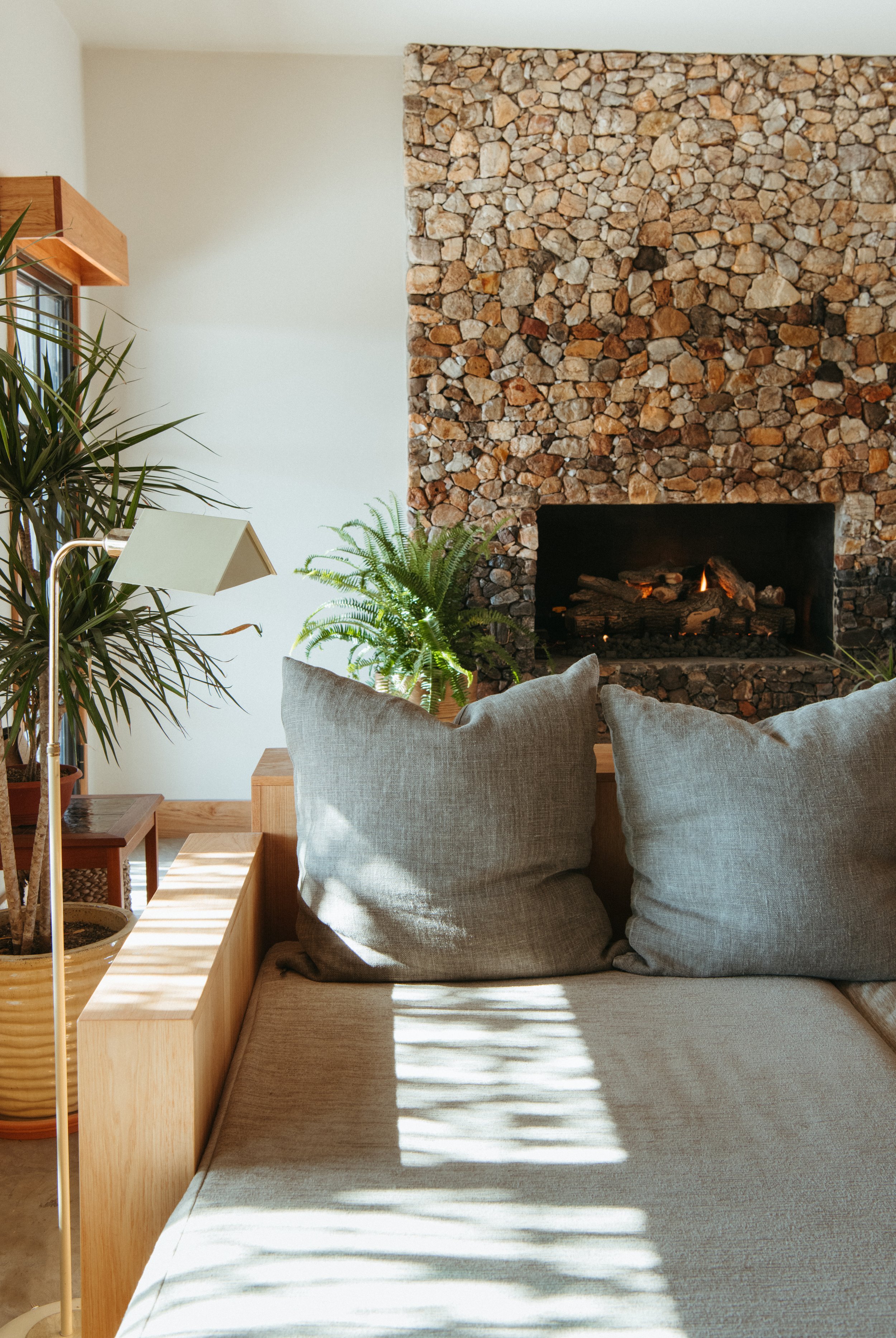 living room fireplace built from hand-selected rocks from the property