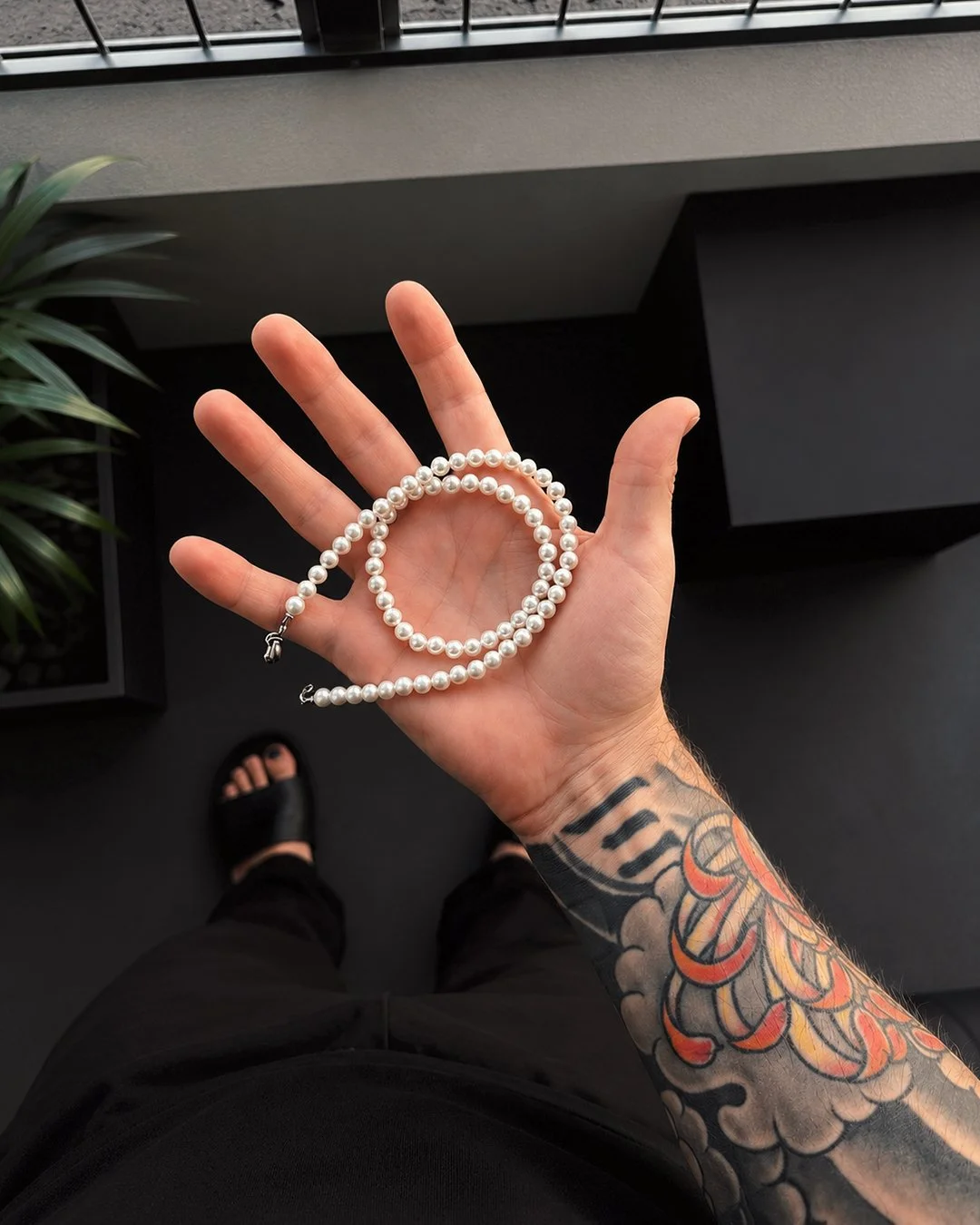pearl necklace in hand.jpg