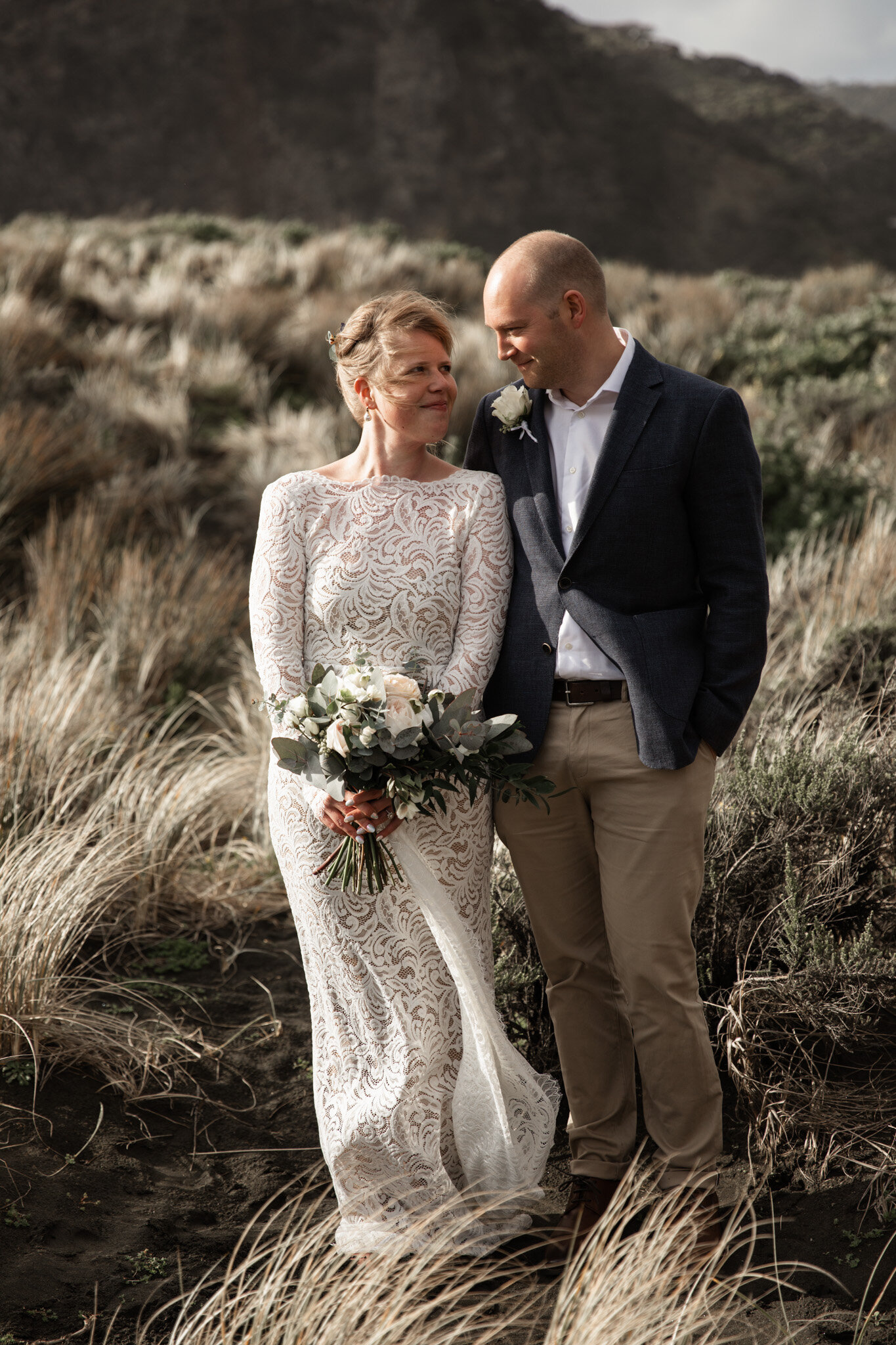 A newly married couple in a field in NZ 