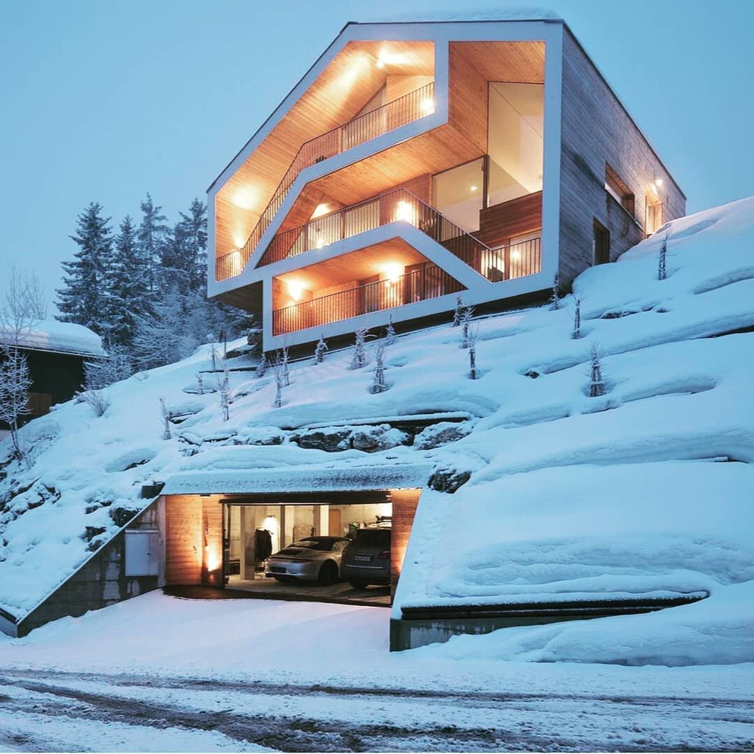 Having a garage is definitely a plus especially in winter climates. The garage at the Chalet Anzere in the Swiss Alps is carved into the side of the mountain. An elevator from the garage gives access to the 3 levels of the home. Photo from decoist. &