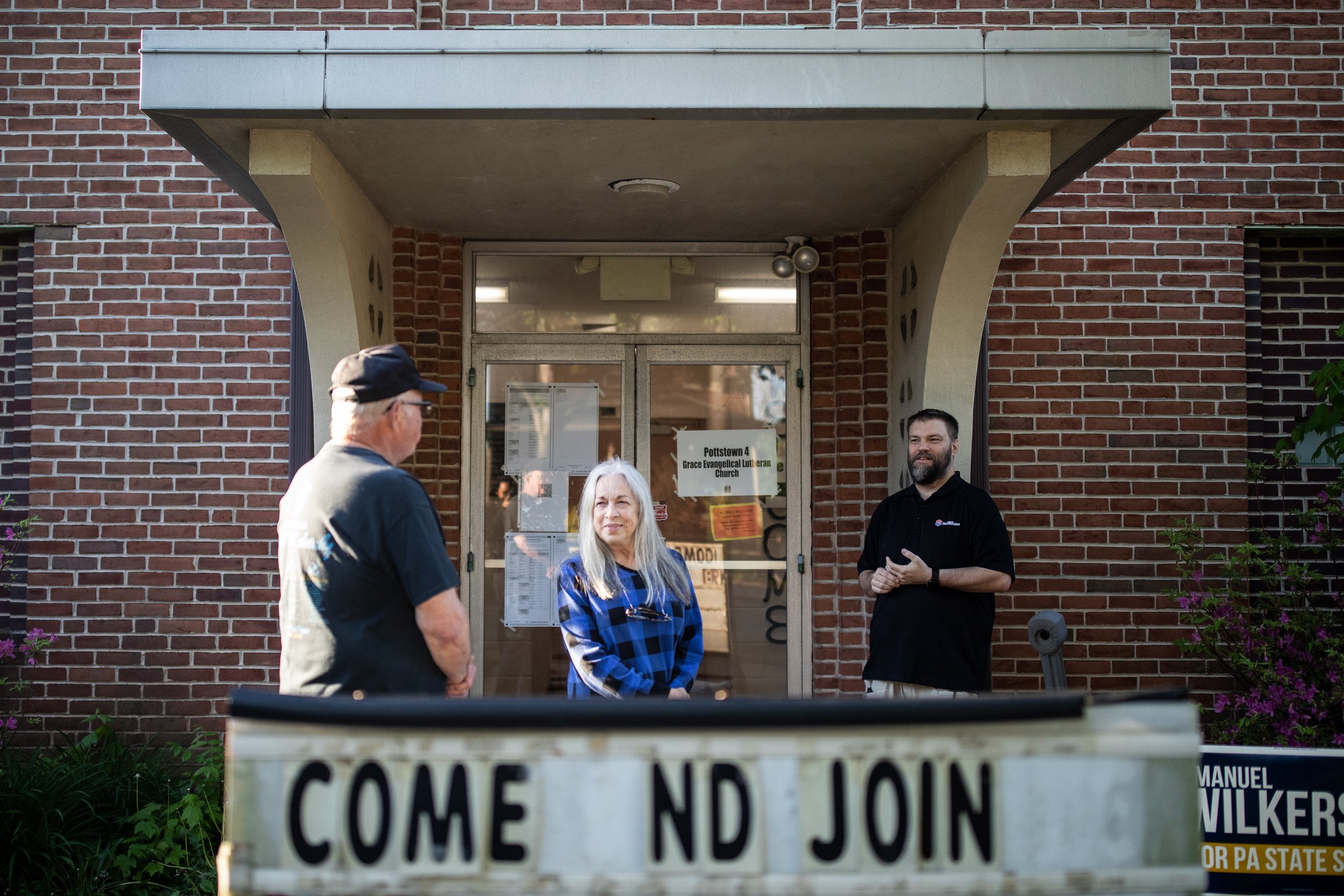   People wait outside a polling place in southwestern Pennsylvania during the primary election in May 2022.  