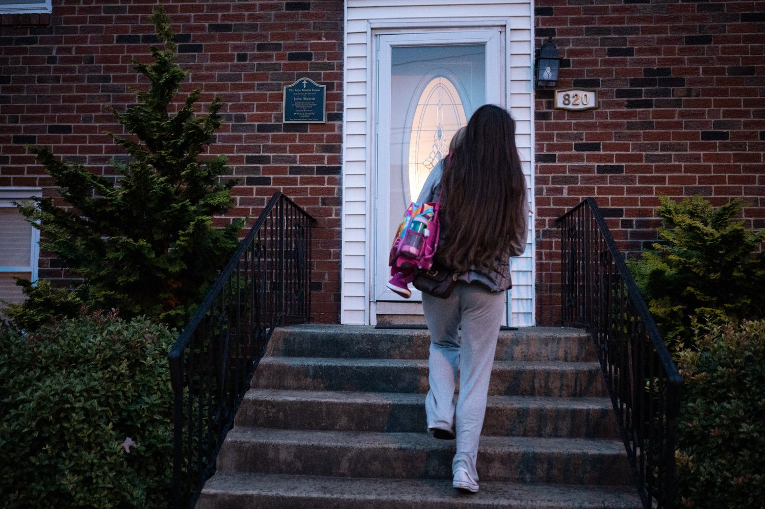   Yuliia Bihun walks into her house which is a part of  Saint Nicholas Orthodox Church in Northern Liberties on Wednesday, Oct. 31, 2022.   