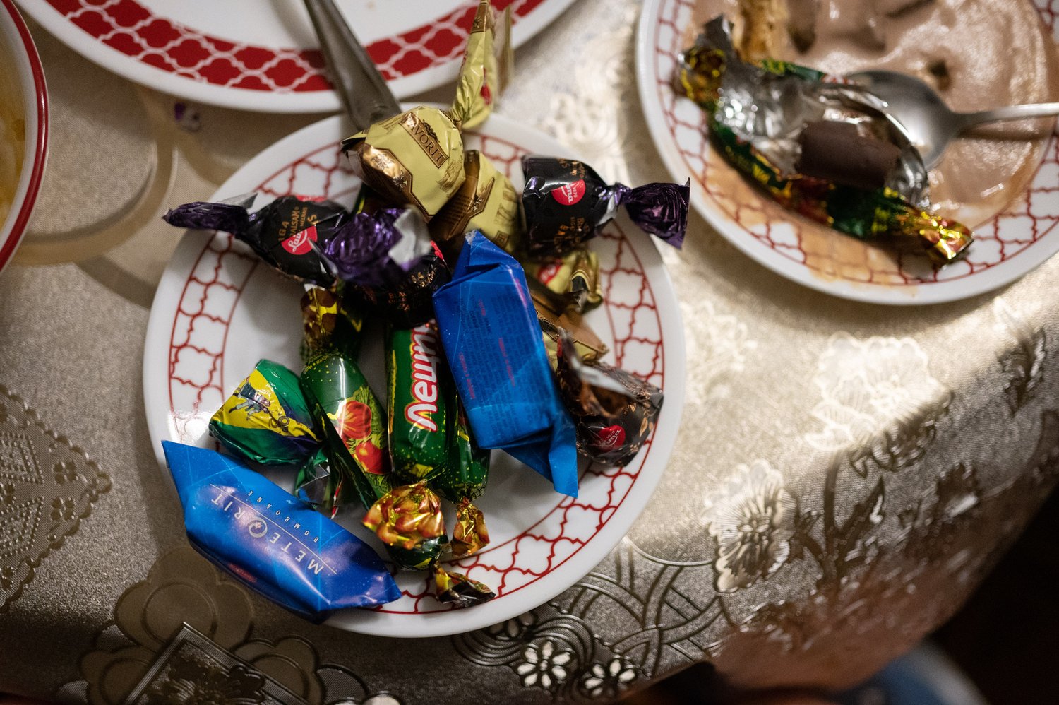   A plate full of Ukrainian candy sits on the dinner table for dessert.  