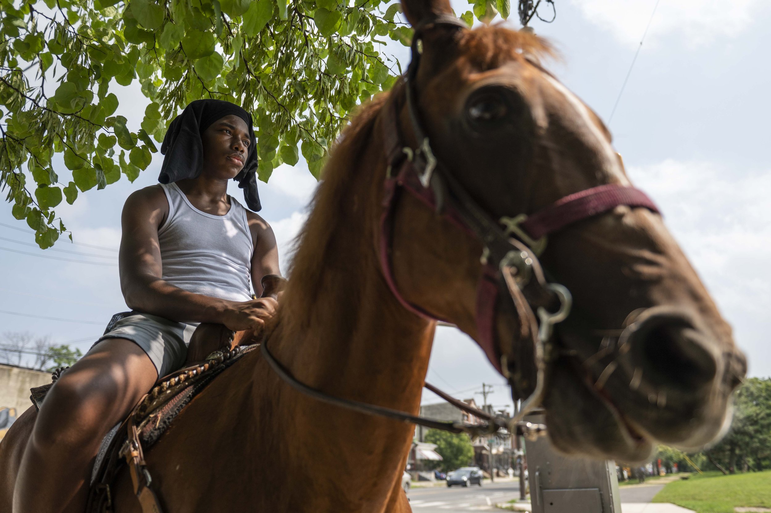   Theron Morris, 15, rides his horse Freida in Strawberry Mansion in Philadelphia, Pa. on Wednesday, July 19, 2023.   