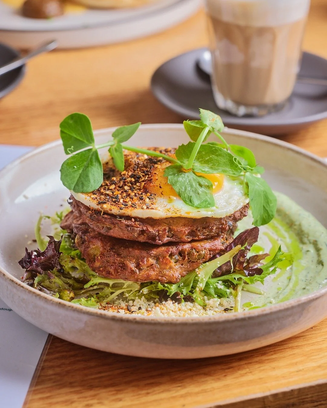 Fritters loaded with all the good stuff - avocado yogurt sauce, feta, za'atar, mint oil, salad and a fried egg.

The team say to add bacon and honestly who are we to argue 😂