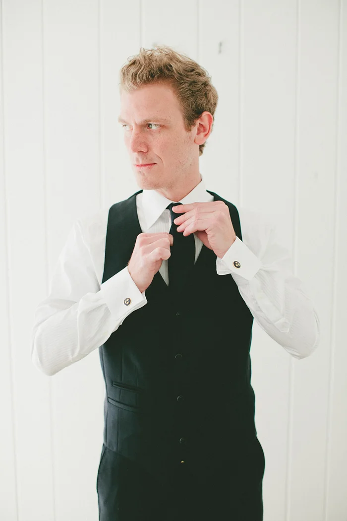 Groom getting ready. Need that photo!