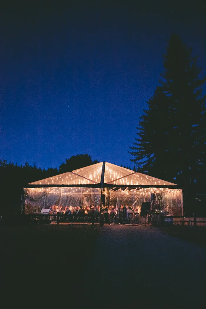 Tented wedding ceremony at night