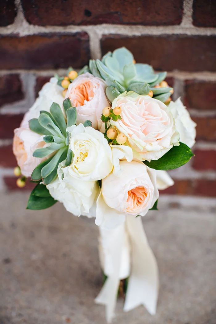 Wedding bouquet with succulents and a rose