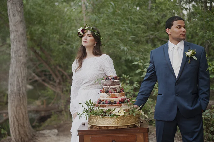 Bride and groom with naked wedding cake
