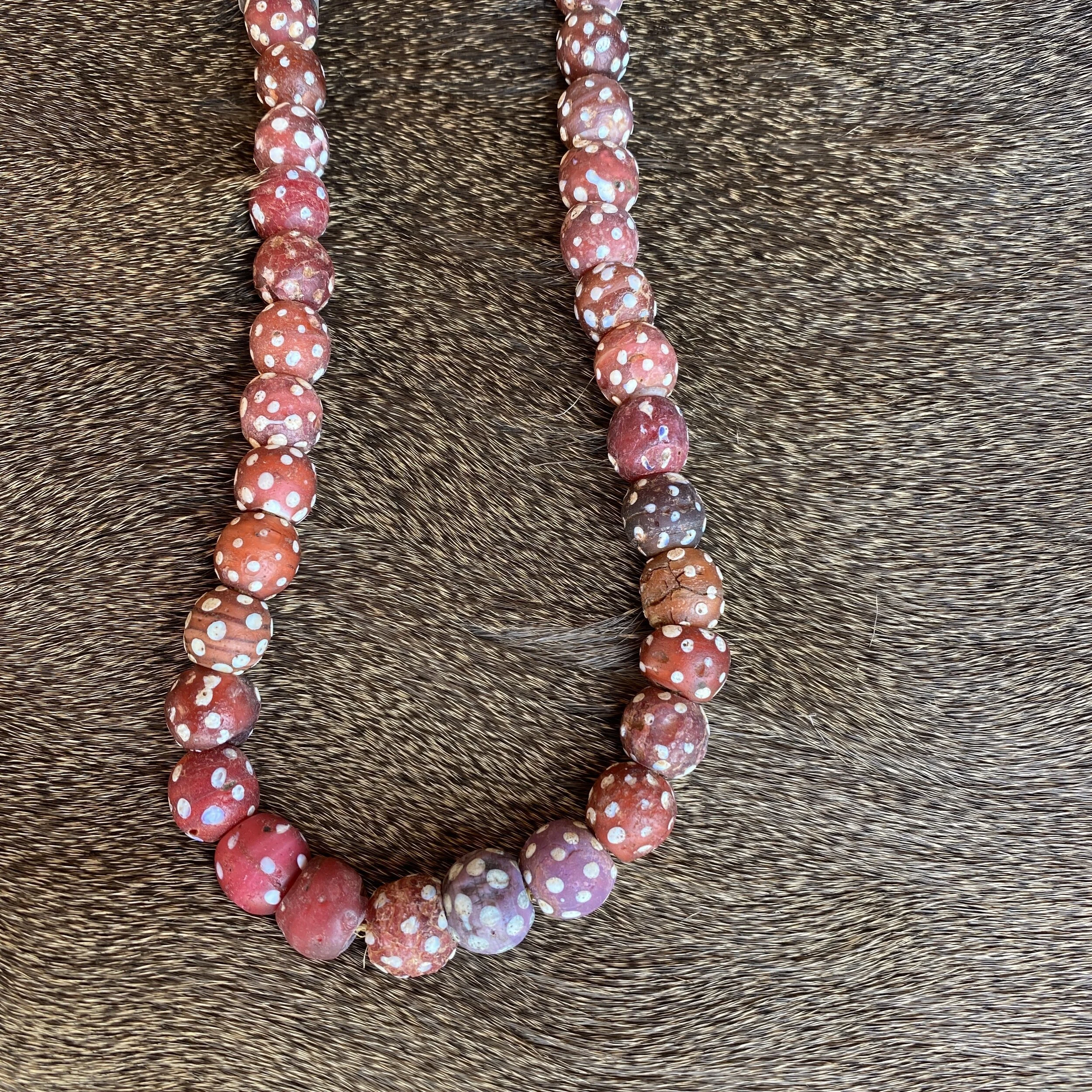 Antique Red Skunk Beads