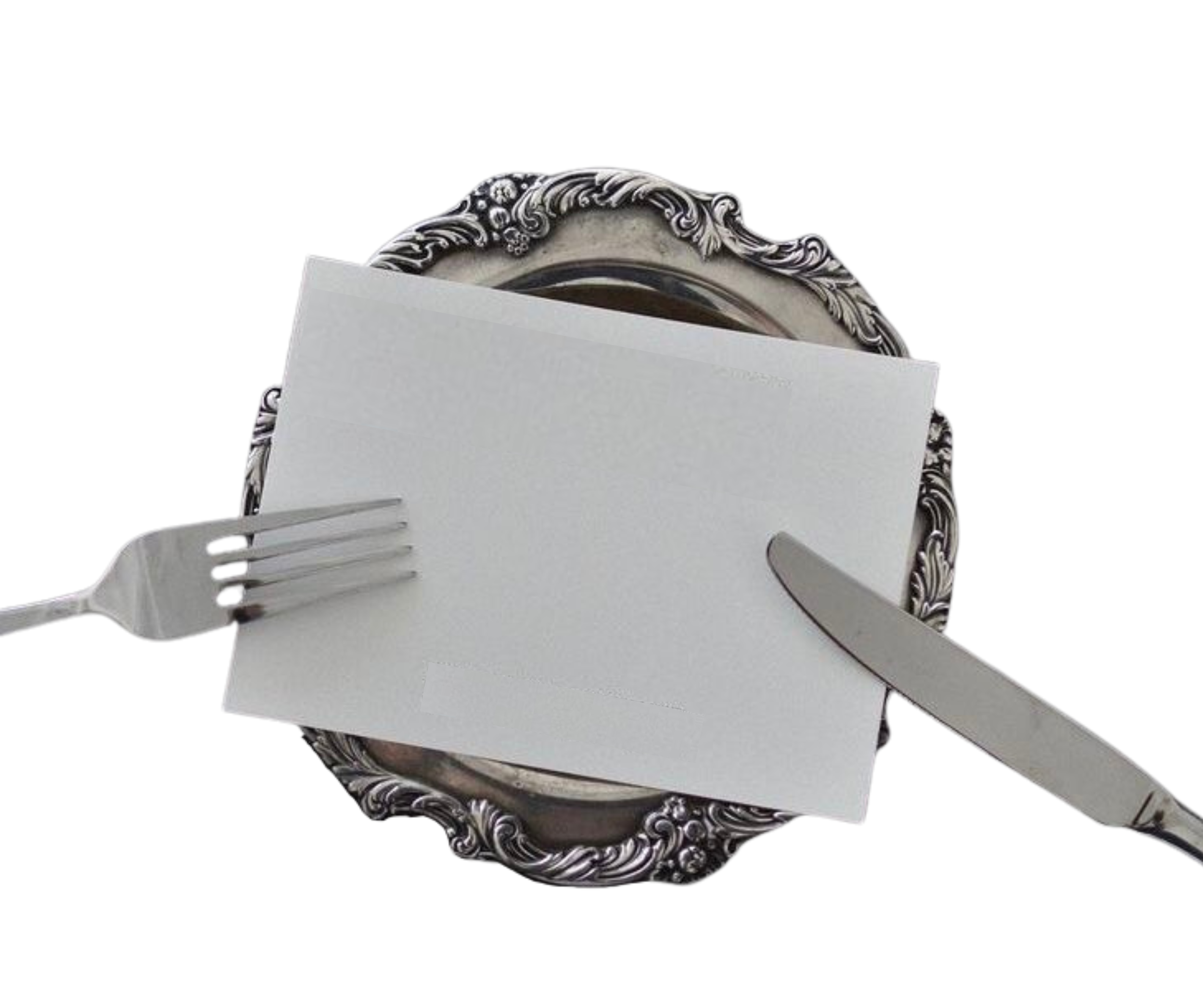 A vintage silver decorative tray with a fork on the left, a butter knife on the right, and a white rectangular napkin or piece of paper folded and placed in the center, against a black background.