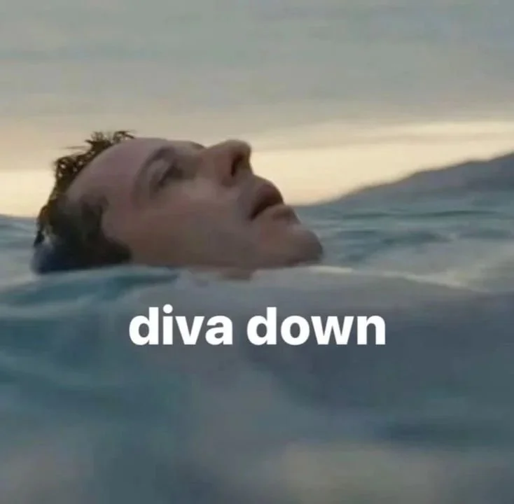A person with wet hair floating in water at sunset, with the caption 'diva down' in white text.