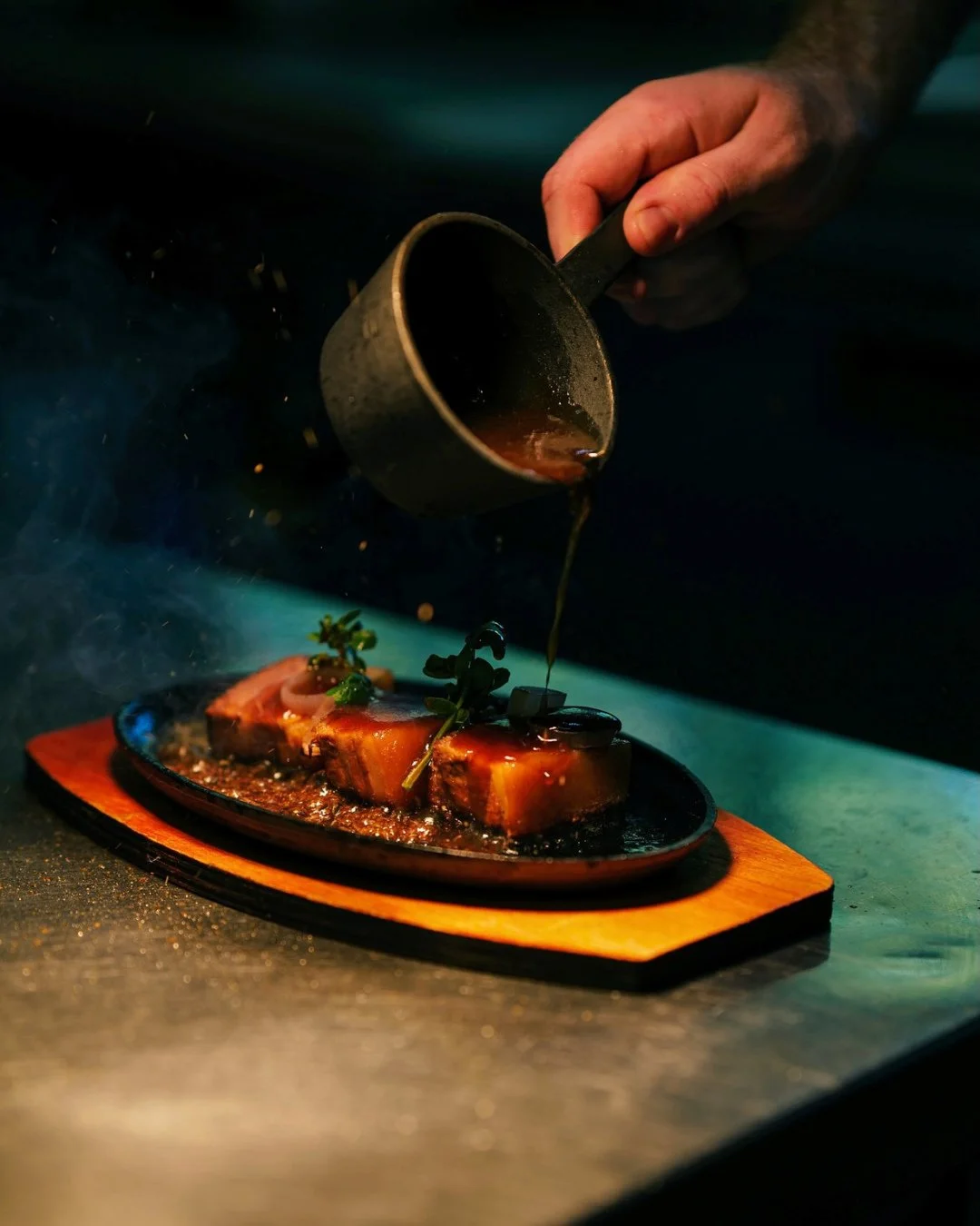 Sizzle first, then silence at the table.⁠
⁠
Our braised pork belly arrives bubbling hot, lacquered in rich masterstock with sweet pickling onions, it's delicious and unapologetically indulgent.⁠
⁠
A dish that makes an entrance&hellip; and disappears 