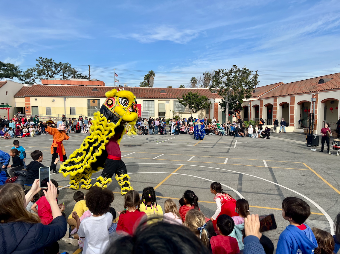 A lion dance in the school playground