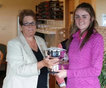 Ella Griffiths receiving the 'Rees Evans Trophy' - Mid Wales Girls Open Champion 2015 from Kath Furneaux, Ladies Captain Aberdovey Golf Club.