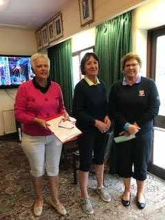 Jenny Lewis of Brecon (R), Margaret Bowen, MWCGA Vice-Captain (L) and Gail Beaurain, St. Idloes Club Chairman (M)