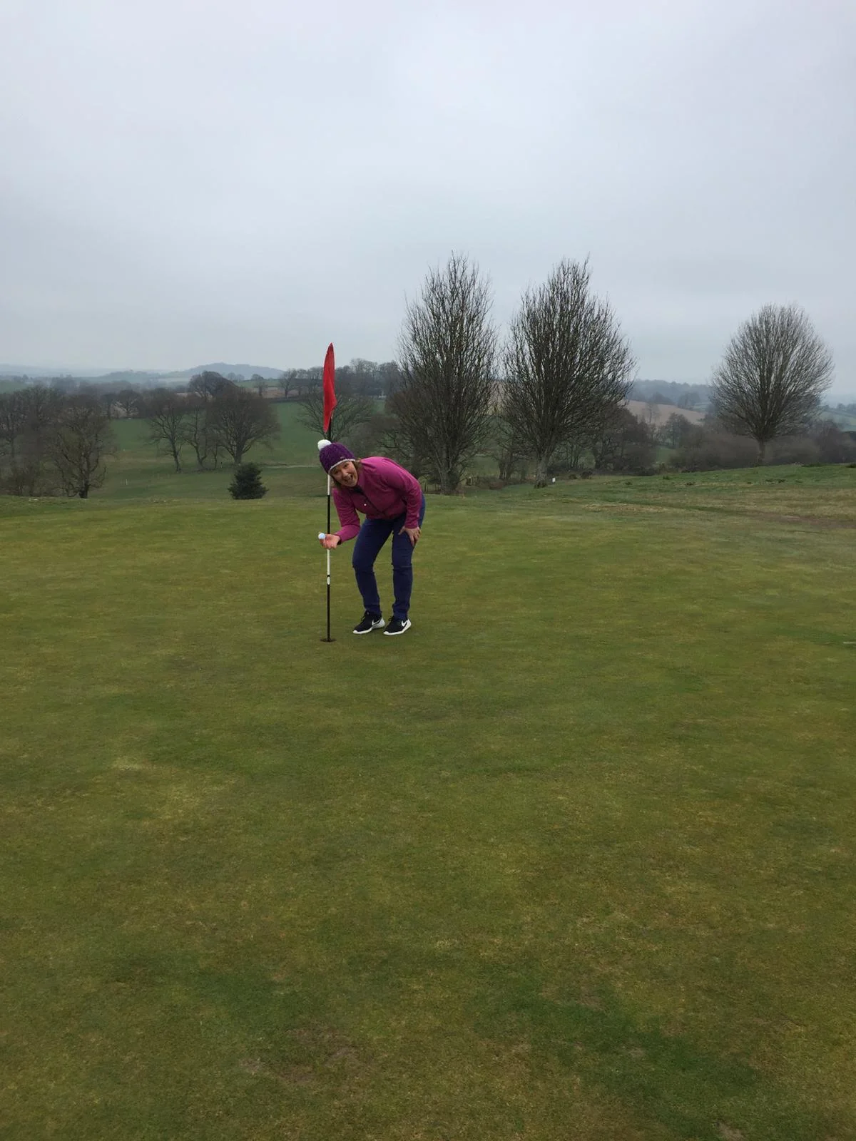 A very happy Hayley Price retrieves her ball from the hole on the 3rd.
