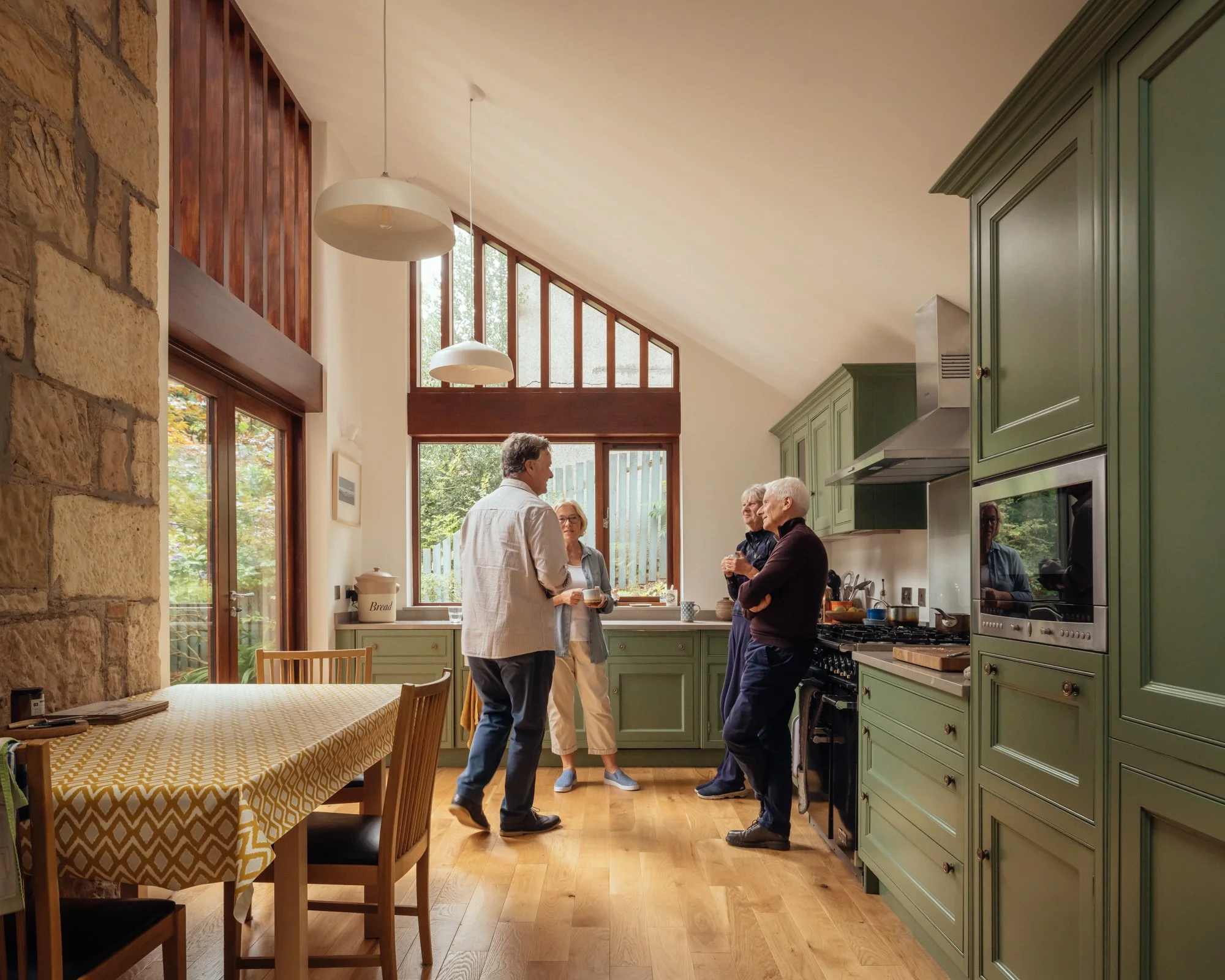 A group of people in a kitchen extension