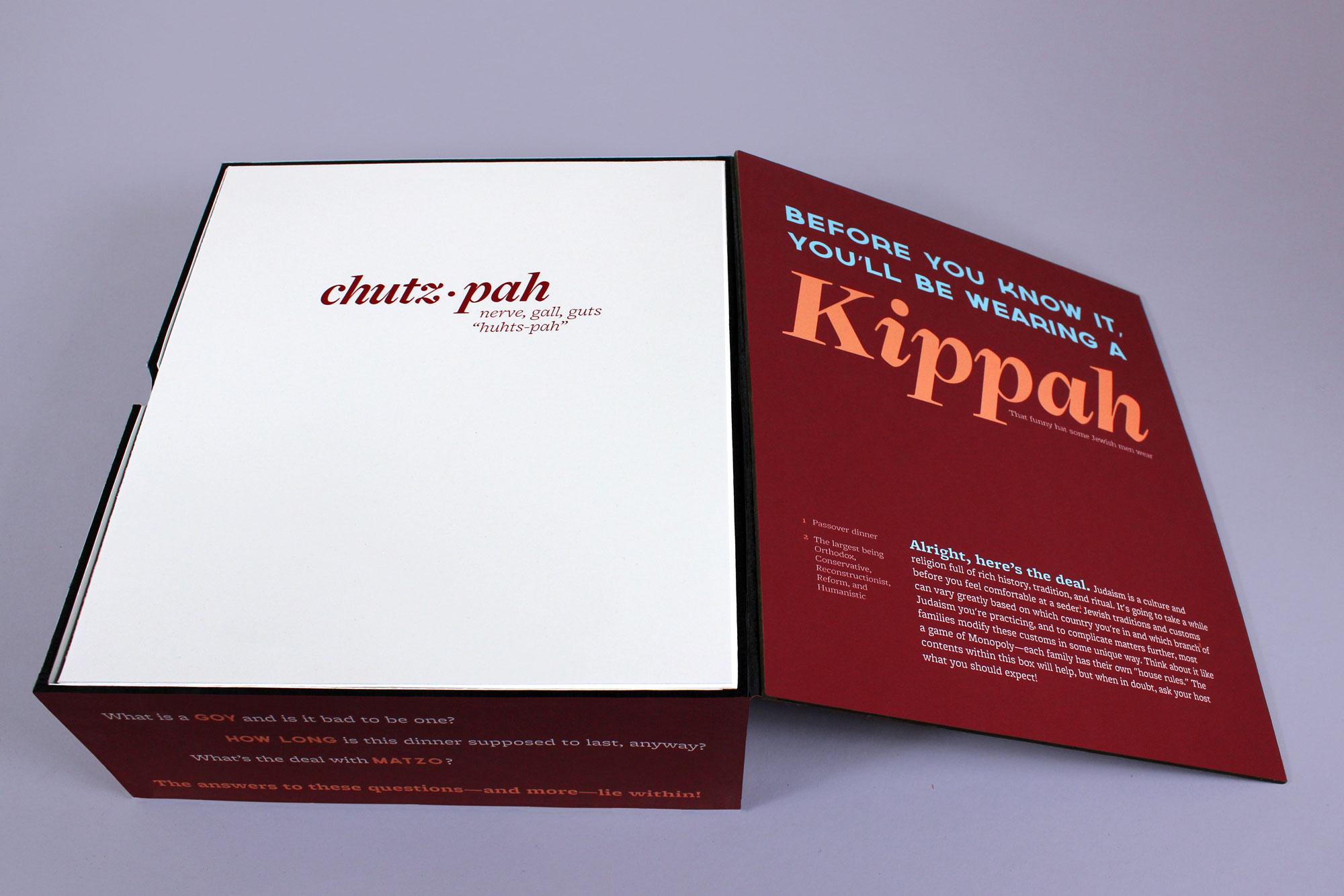 The first things the viewer will see after opening the box are the lid, with general information on it, and a flat insert defining the term “chutzpah.”