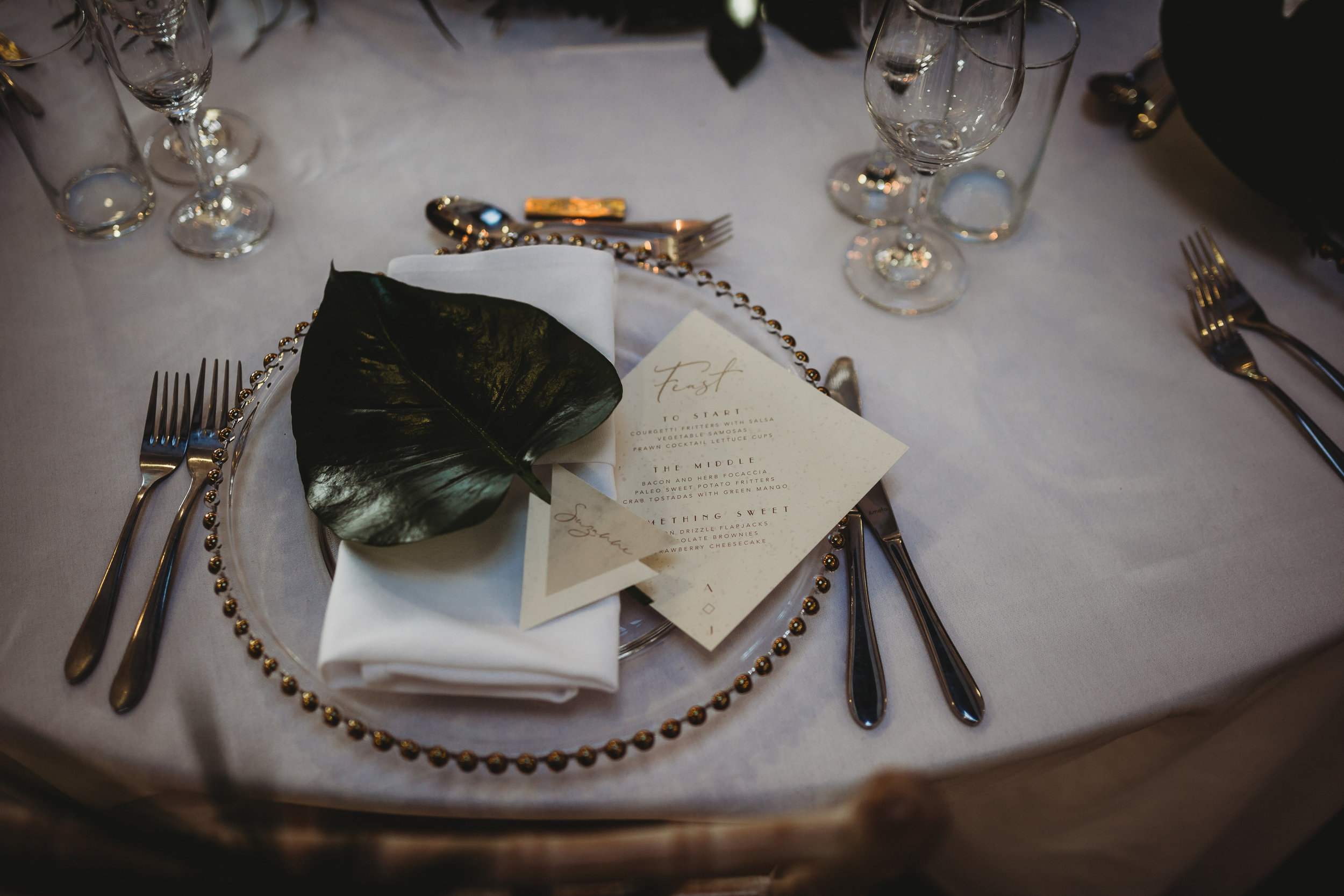  Modern wedding place setting with foliage decoration by All Bunched Up wedding flowers at The Pumping House, Ollerton. 