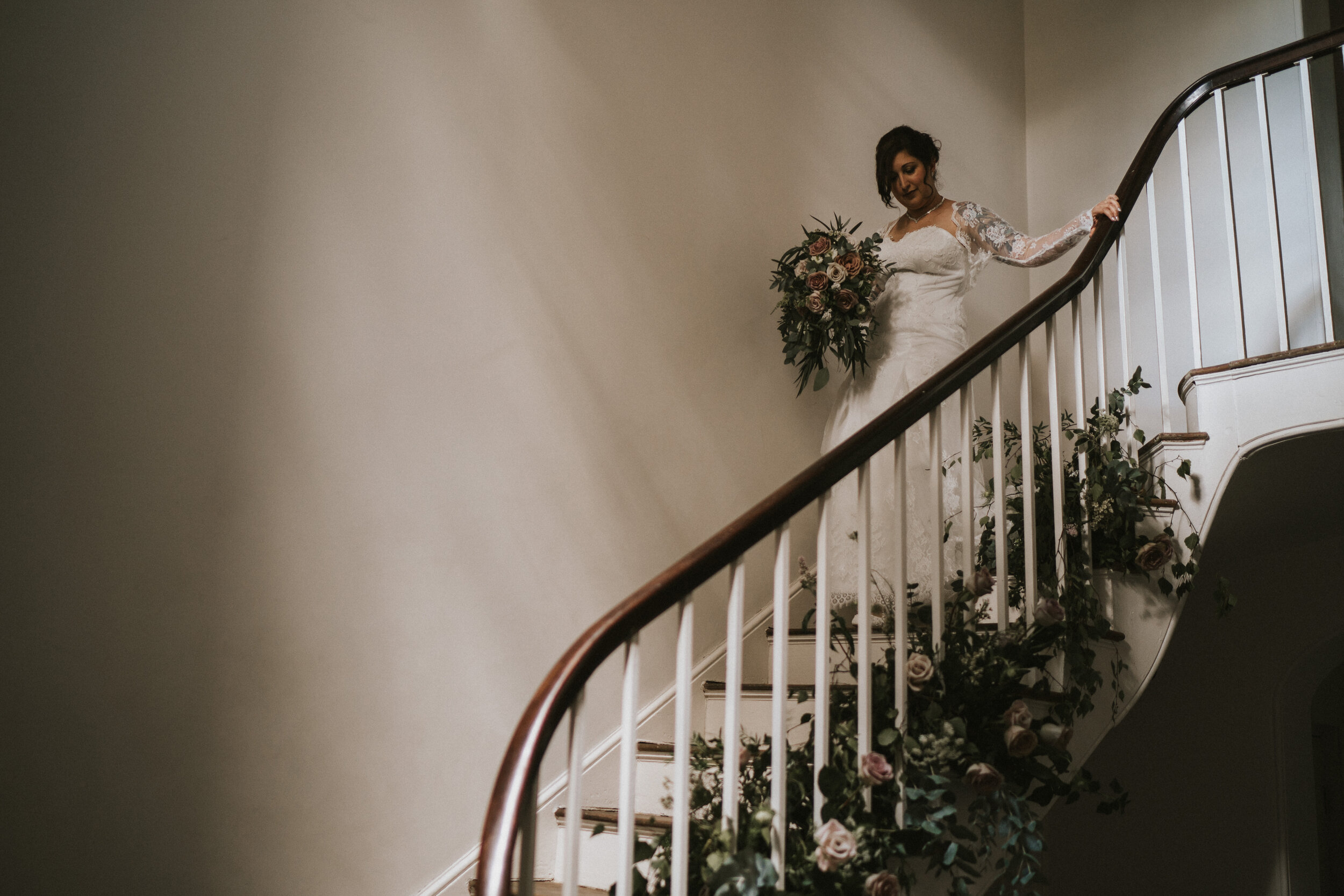  Bride descending the stair before the wedding ceremony at Aswarby Rectory, Sleaford. Wedding flowers by All Bunched Up. 