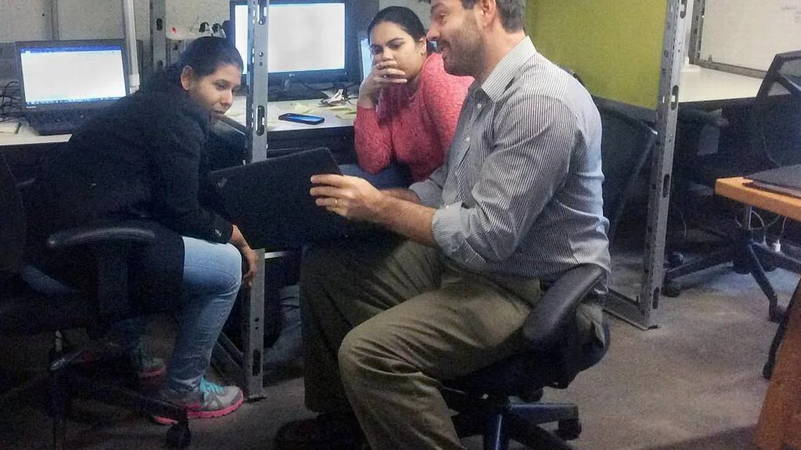 From right, Quantworks co-founder Anthony Volpe talks about an analytics project with system administrators Juhi Desai and Swathi Katta on Tuesday, Nov. 29, 2016, on the second floor of Launch Chapel Hill at 321 W. Rosemary St. in Chapel Hill, NC. TAMMY GRUBB TGRUBB@NEWSOBSERVER.COM