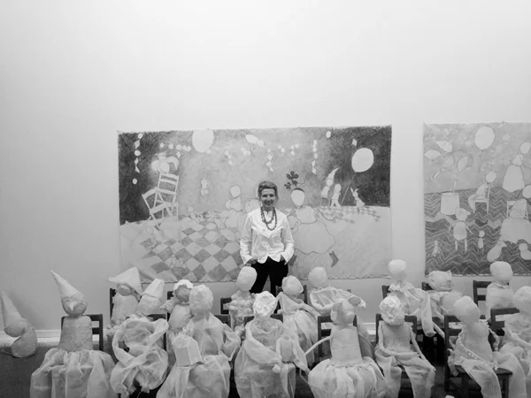 Constance Slaughter with her work, Four-and-Twenty Blackbirds