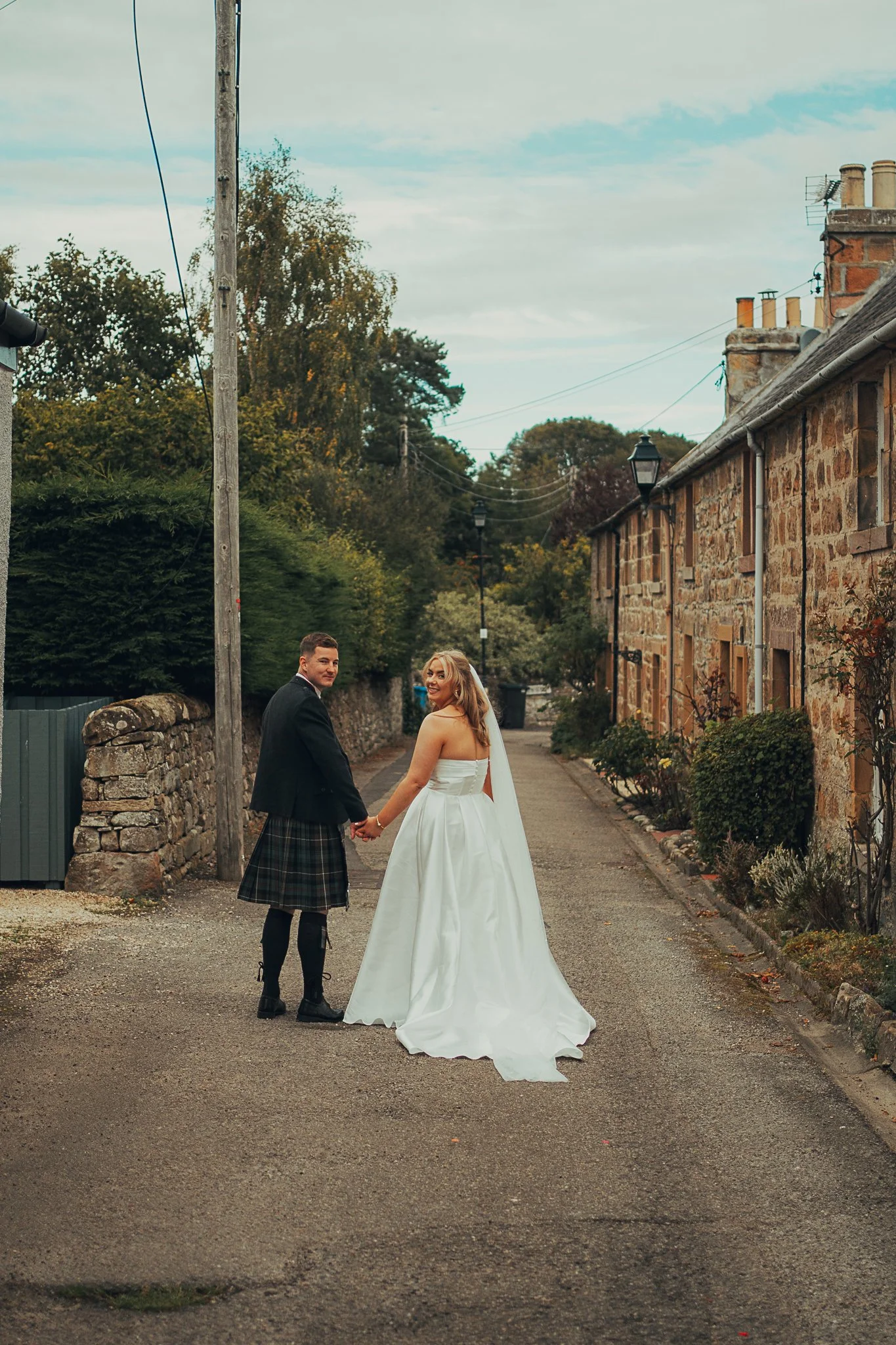 bride-groom-dornoch-street-highland-wedding.jpg