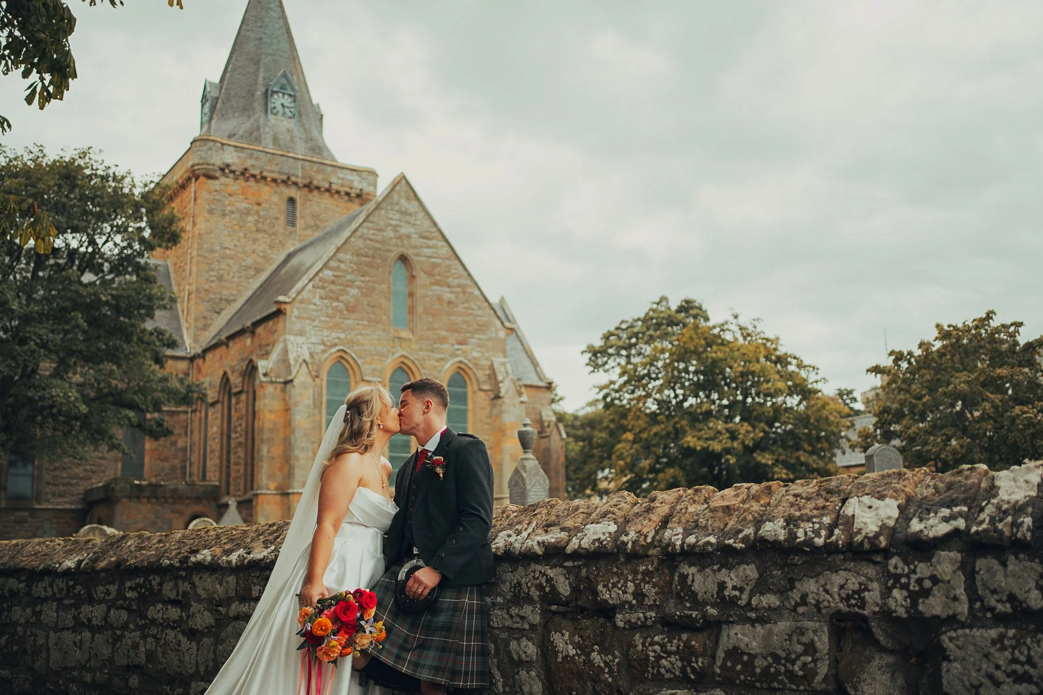 couple-outside-dornoch-cathedral-highland-wedding.jpg