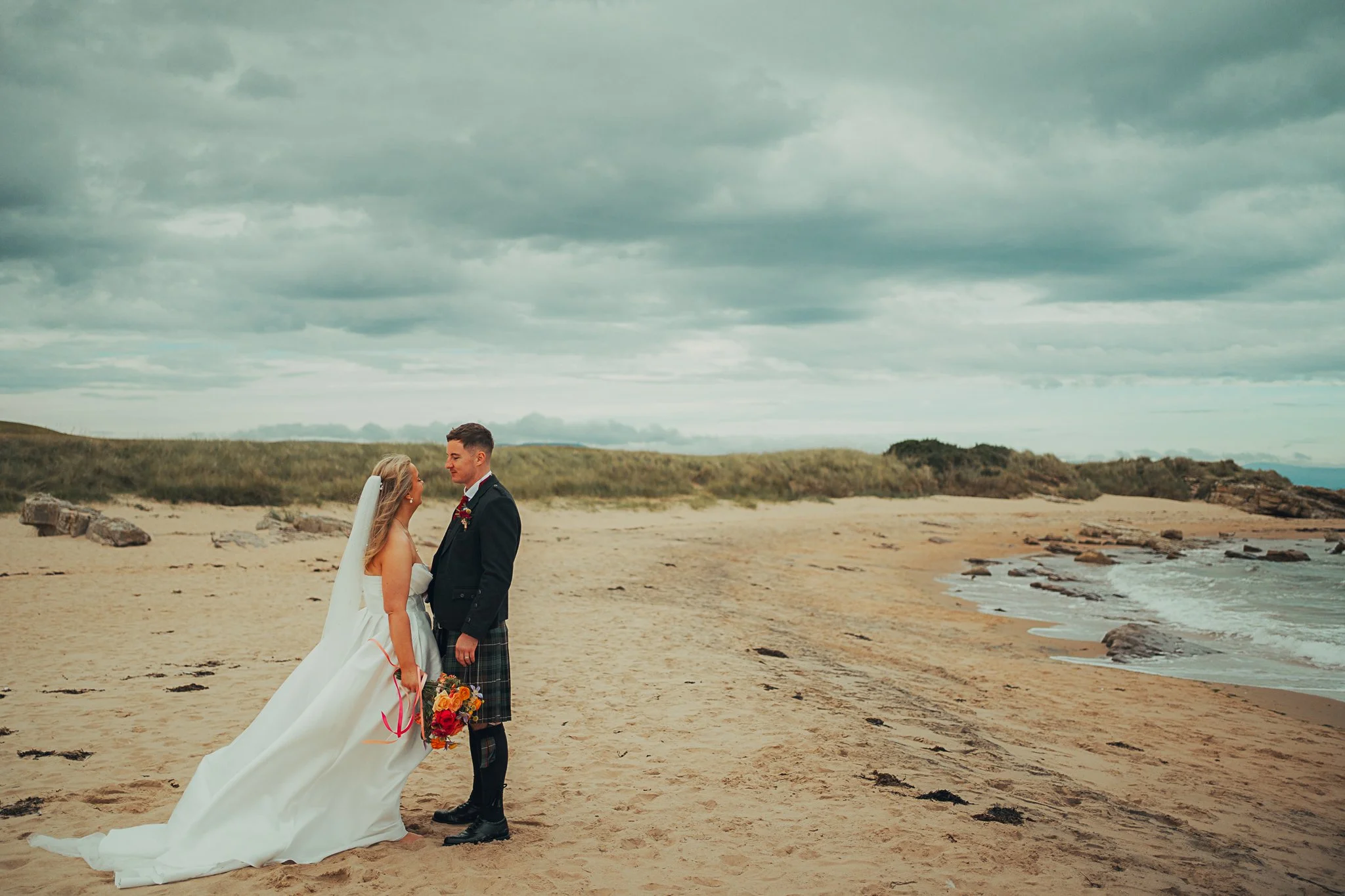 fun-couple-dornoch-beach-highland-wedding.jpg