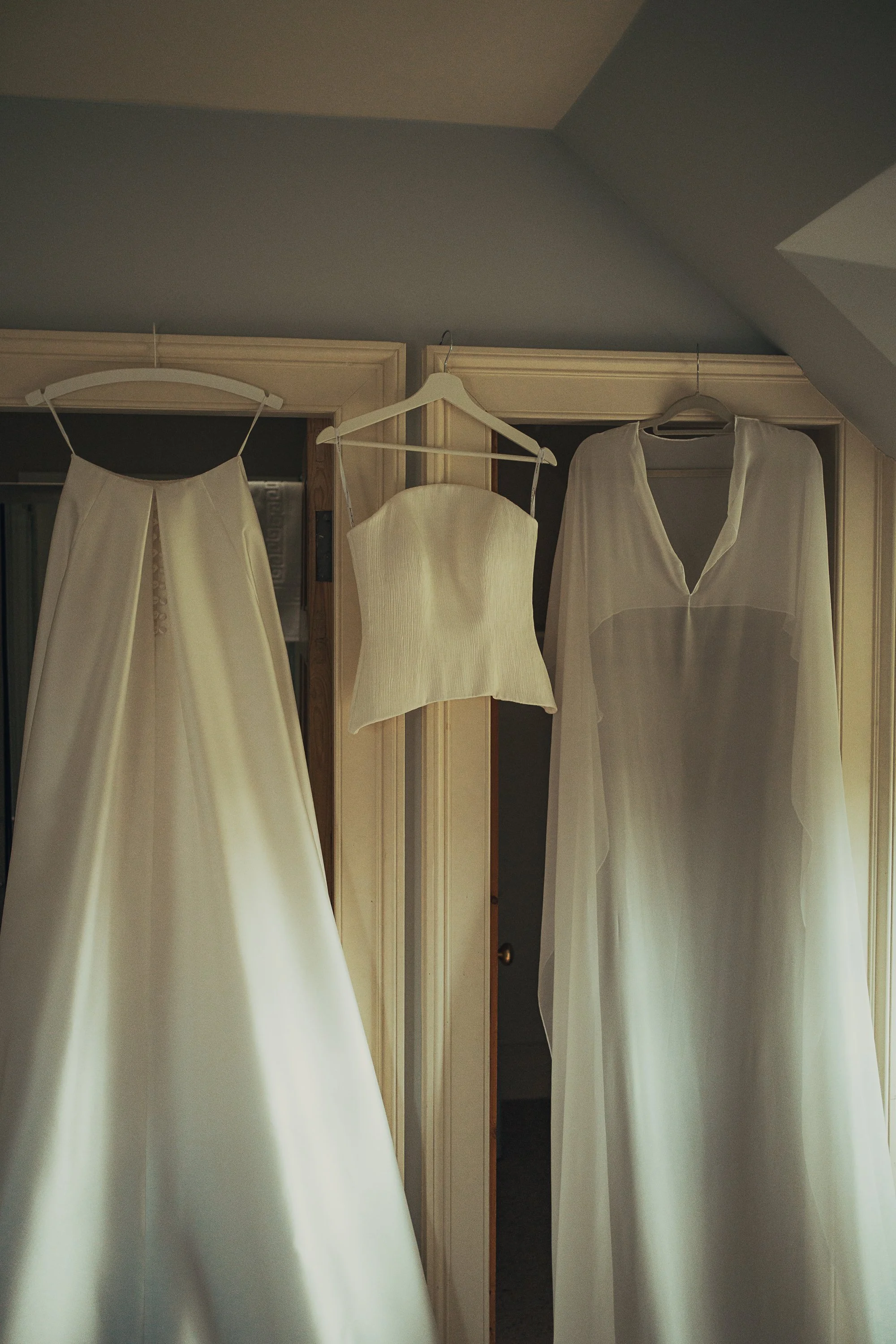 three-piece-bridal-gown-hanging-wedding-morning.jpg