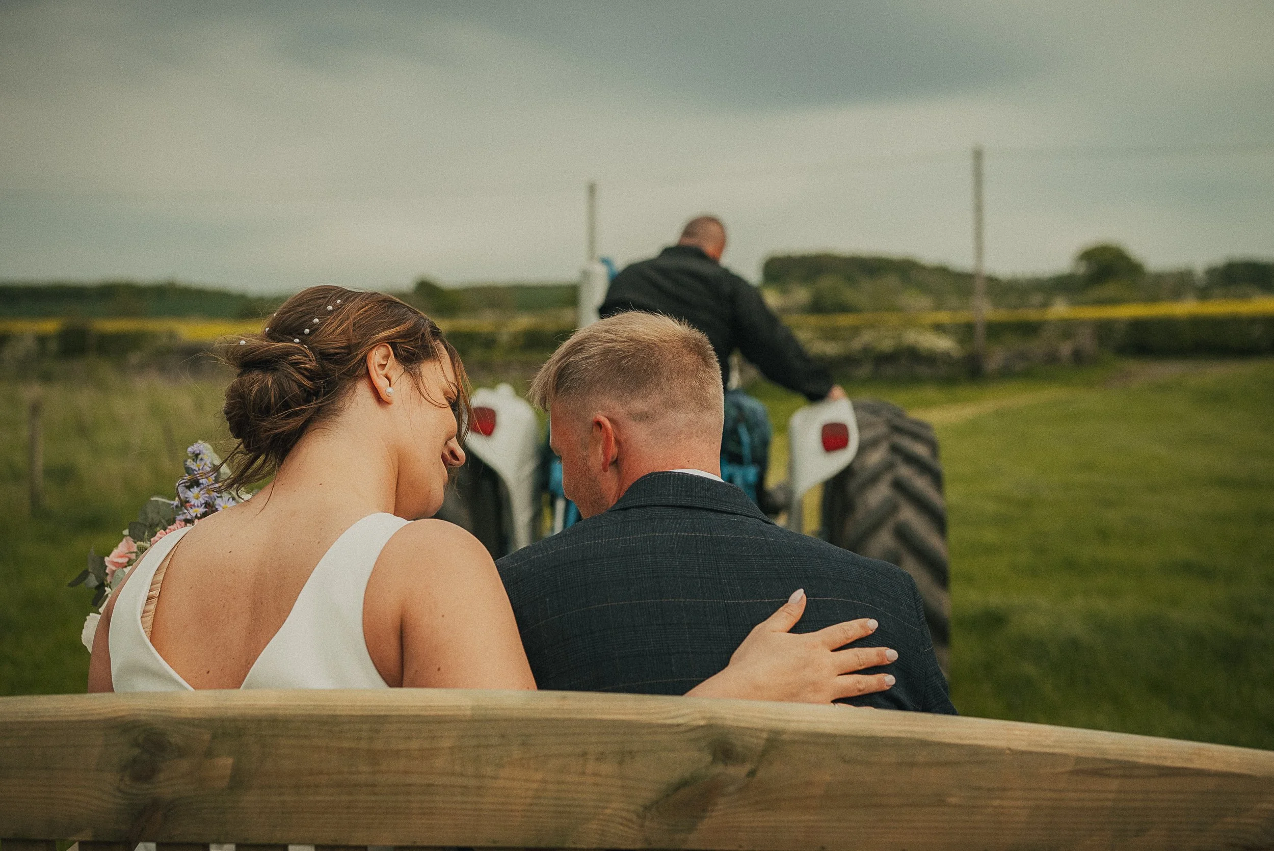 bride-groom-tractor-trailer-scottish-farm-wedding.jpg