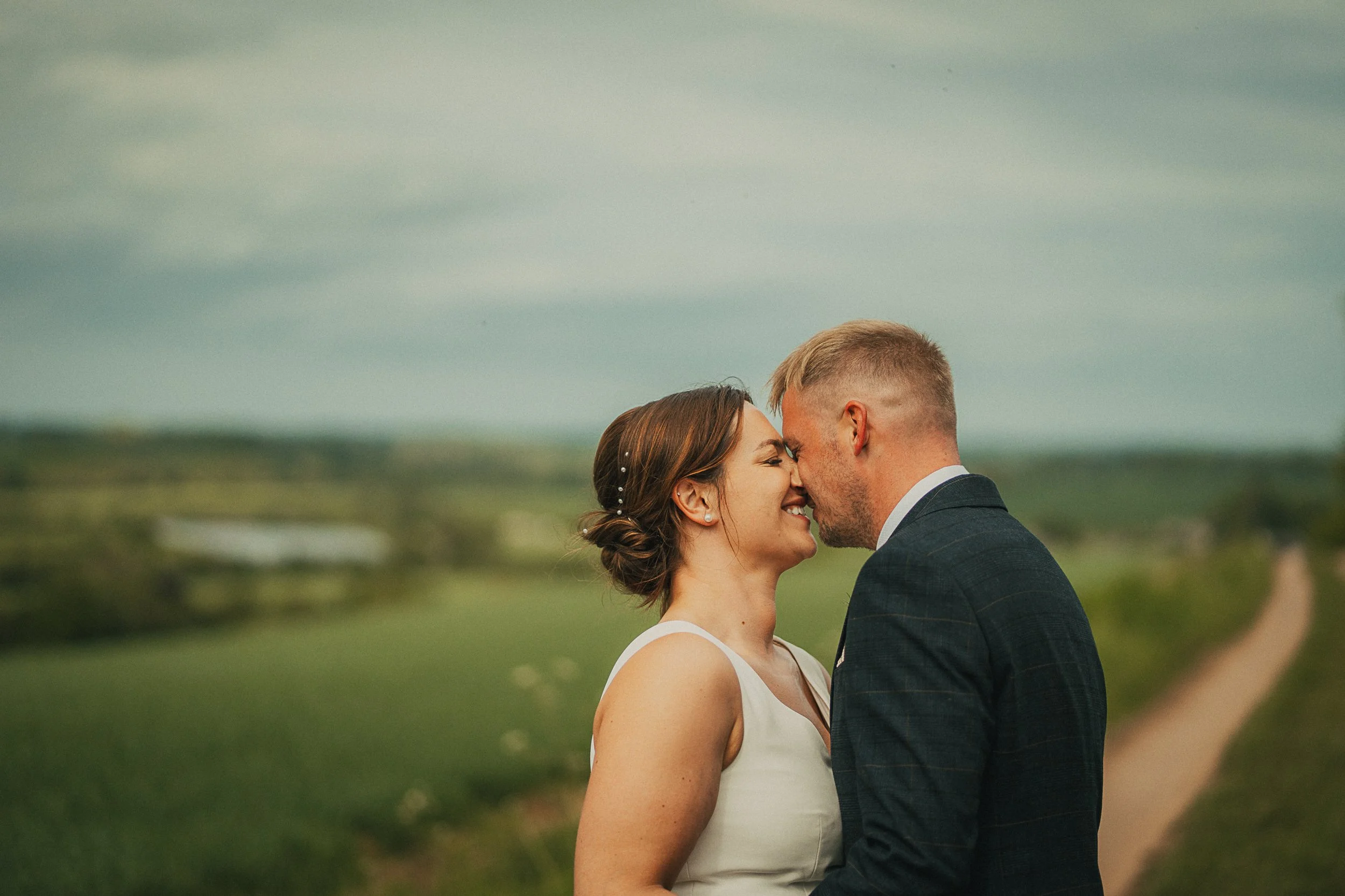 bride-groom-kiss-scottish-farm-wedding.jpg