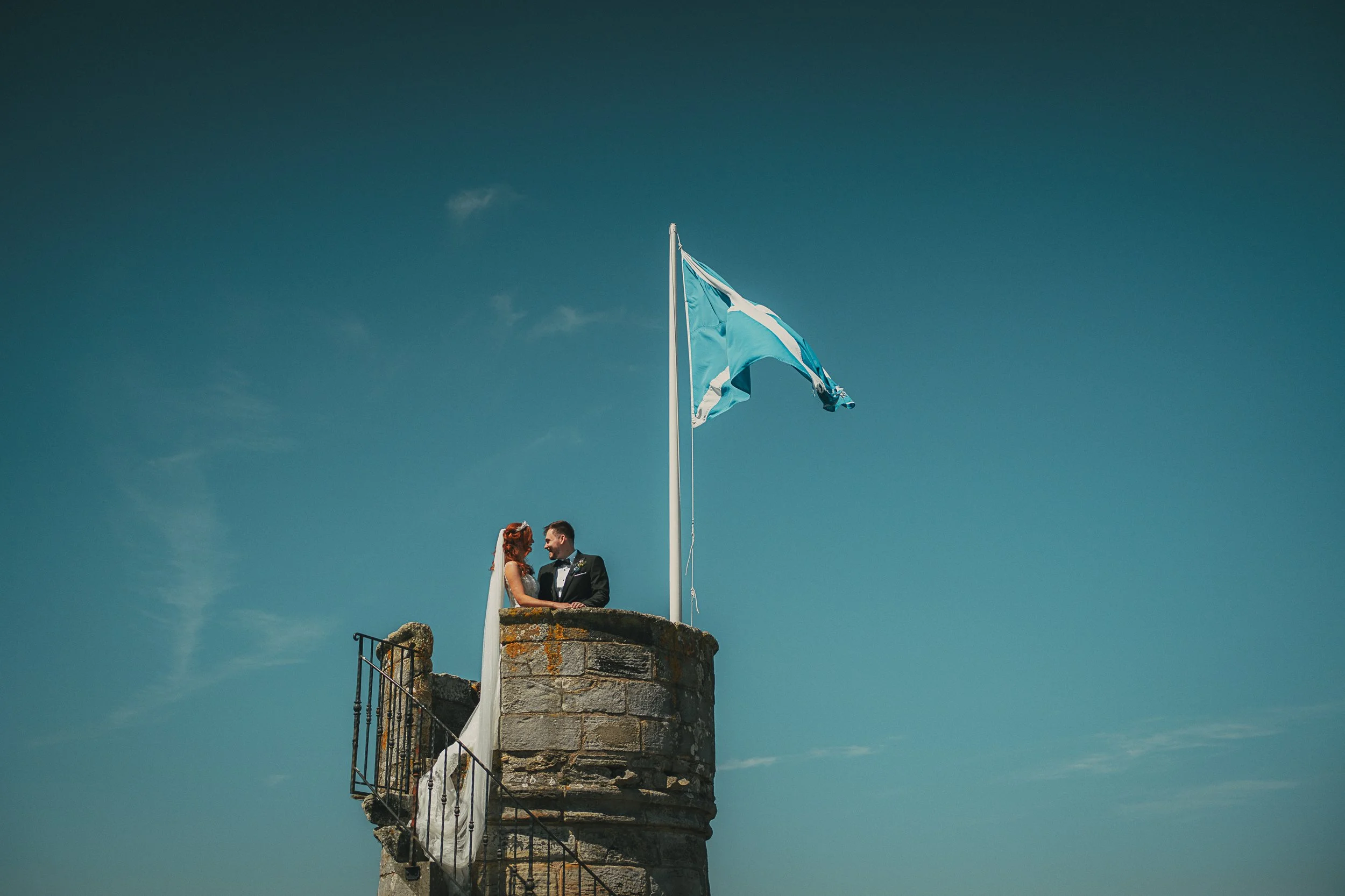 dundas-castle-turret-keep-couple-scotland-flag-wedding.jpg