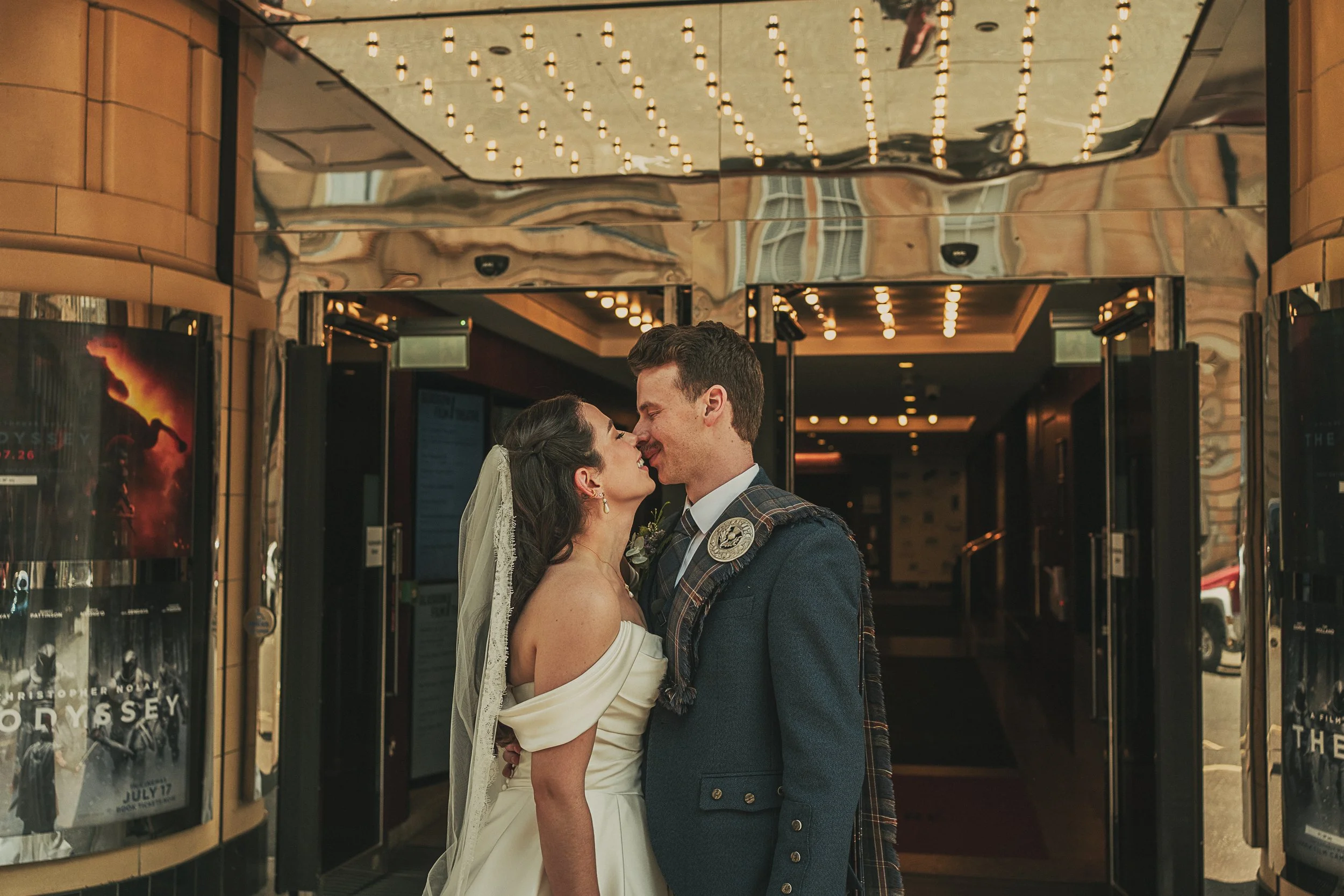 claire-adam-kissing-glasgow-film-theatre-wedding.jpg