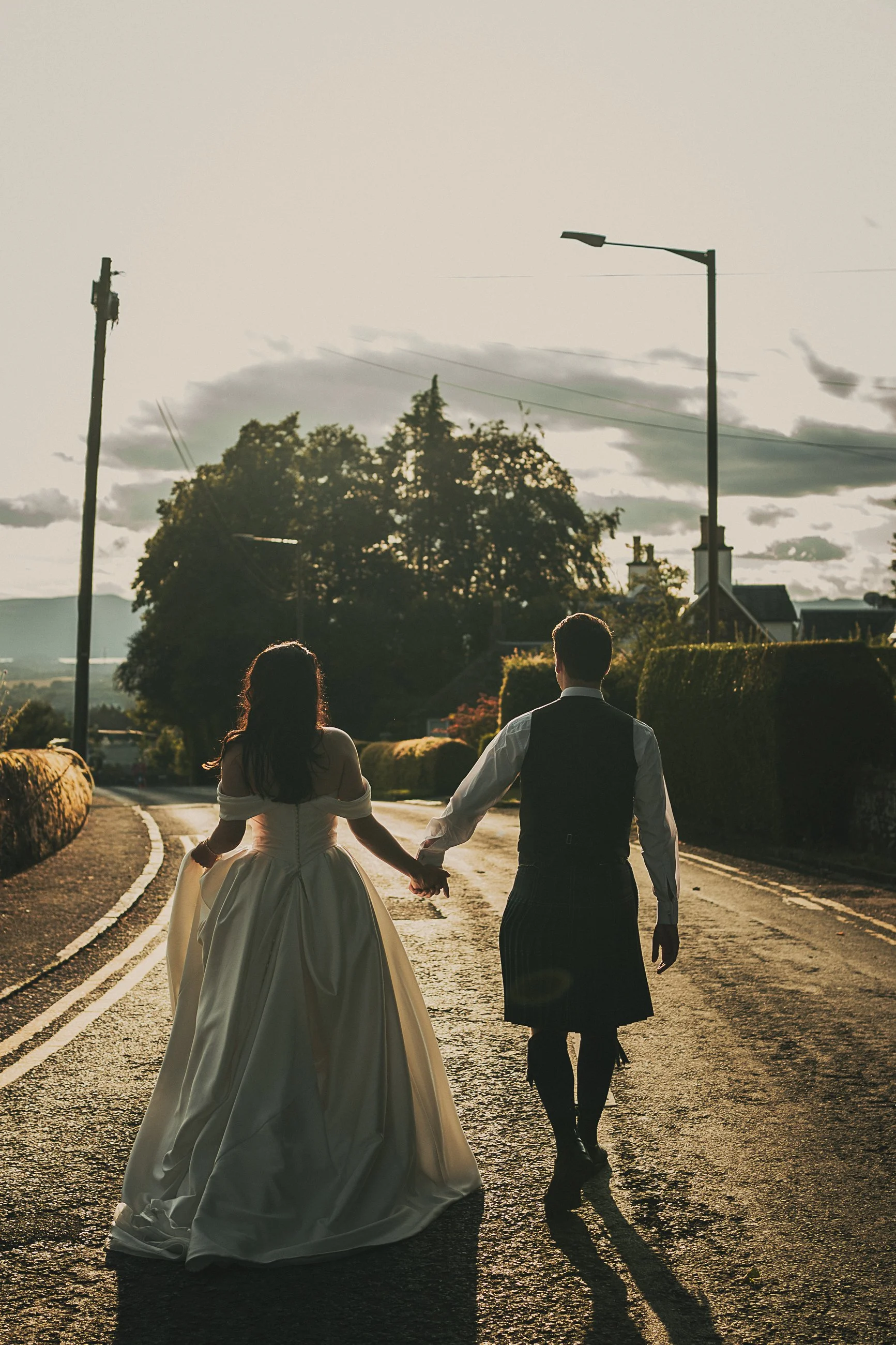 claire-adam-couple-portrait-walking-killearn-street.jpg