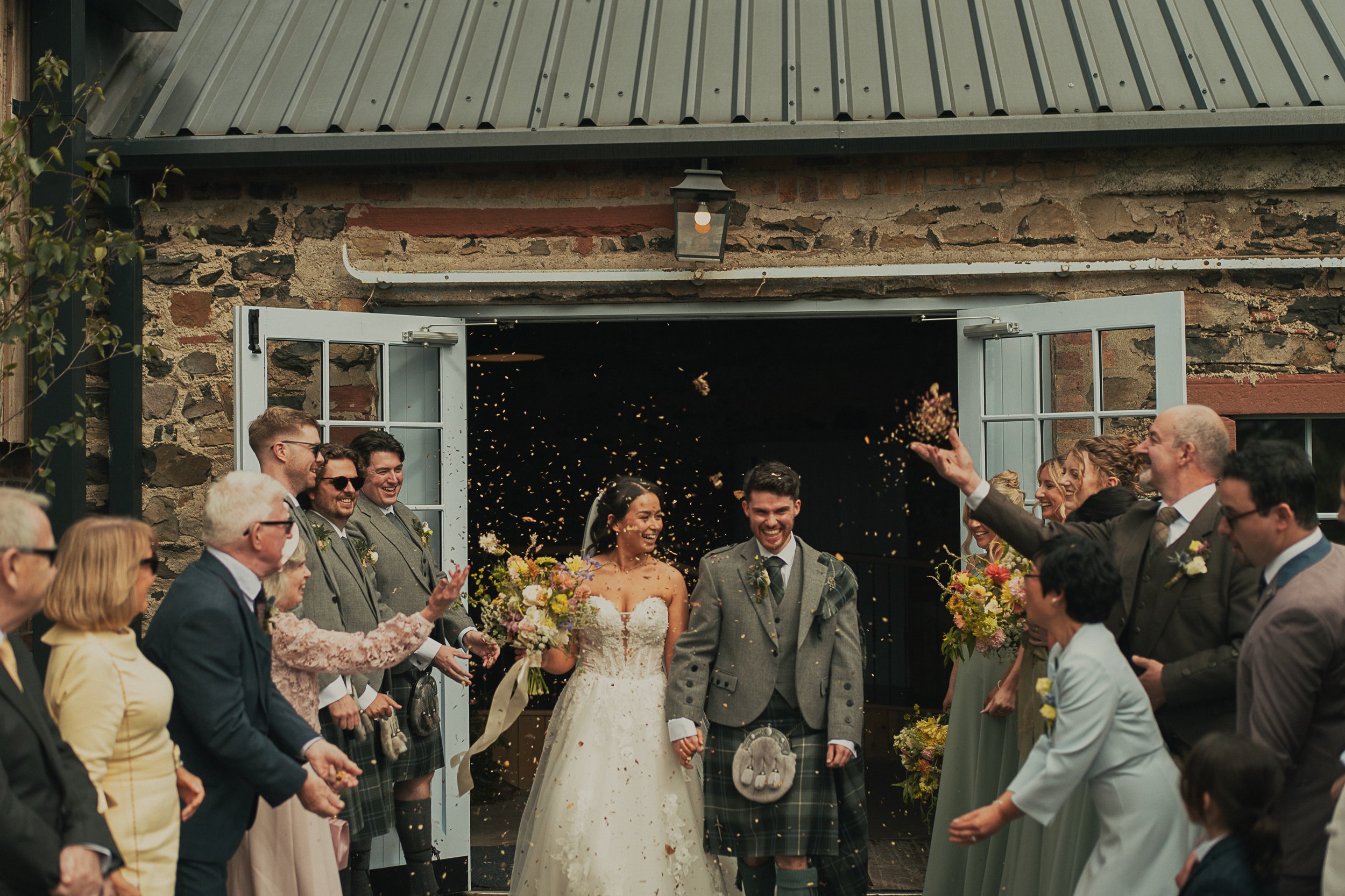 josie-david-confetti-tunnel-scottish-wedding.jpg