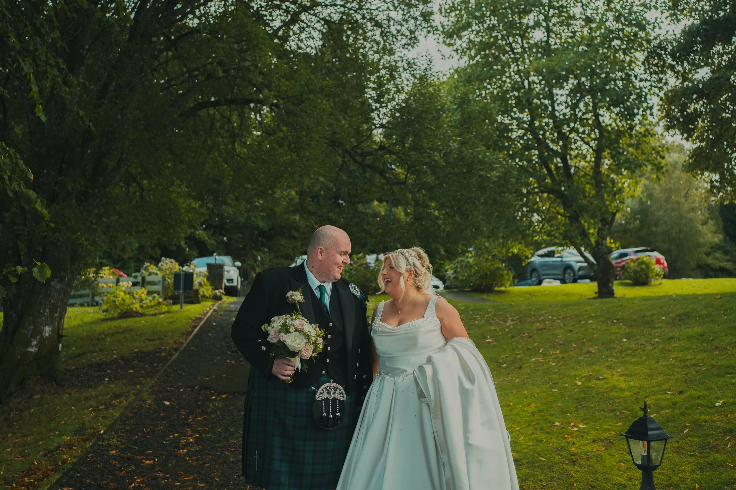 laura-nicky-the-cruin-loch-lomond-wedding-couple-walking-path.jpg