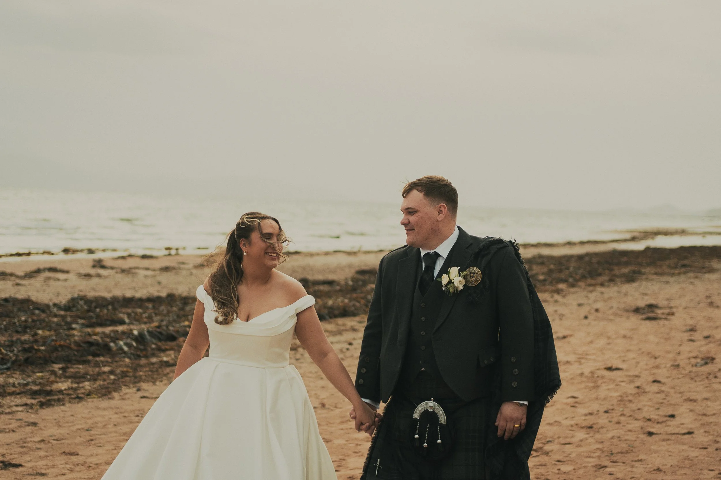 gill-callum-seamill-hydro-wedding-beach-walk.jpg
