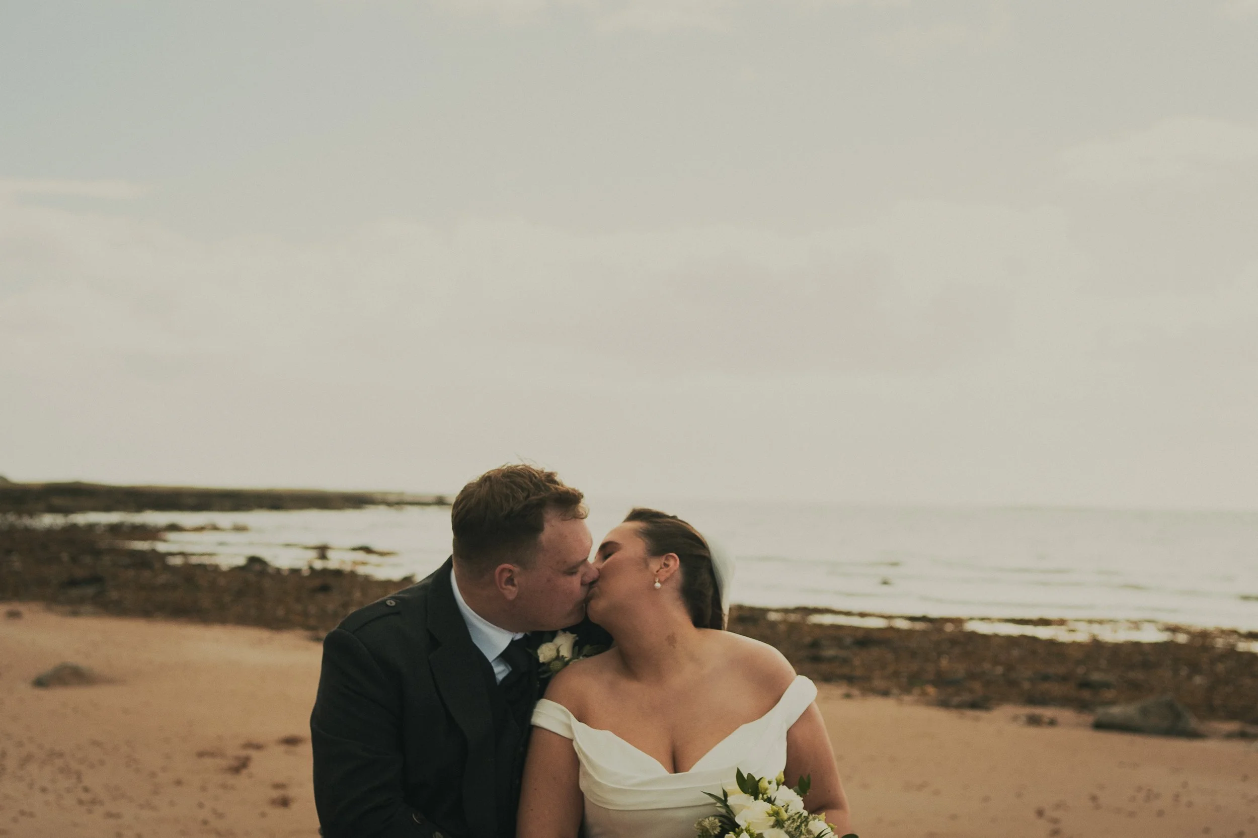 gill-callum-seamill-hydro-wedding-beach-kiss.jpg