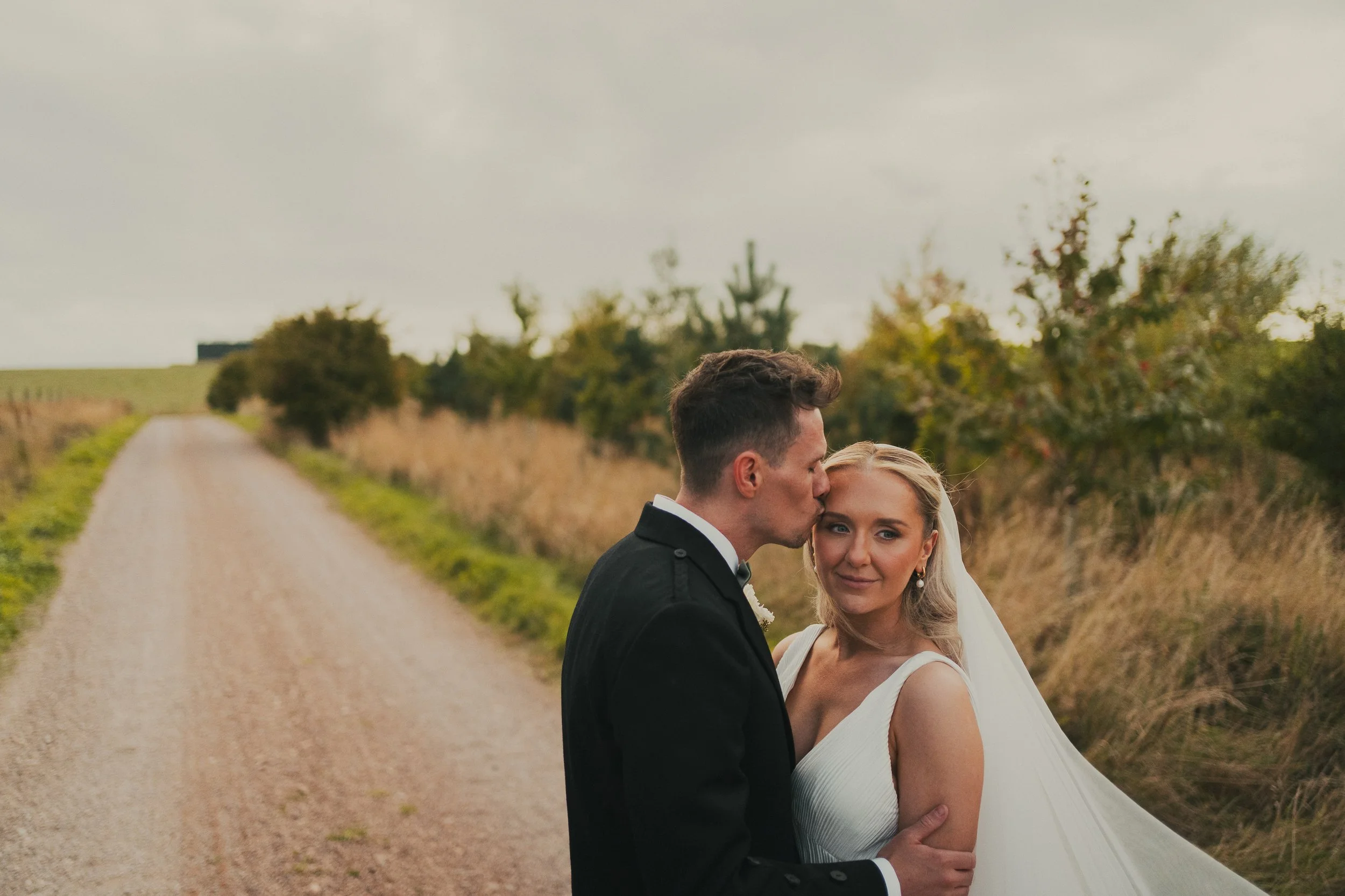 robyn-robbie-falside-mill-wedding-couple-portrait.jpg