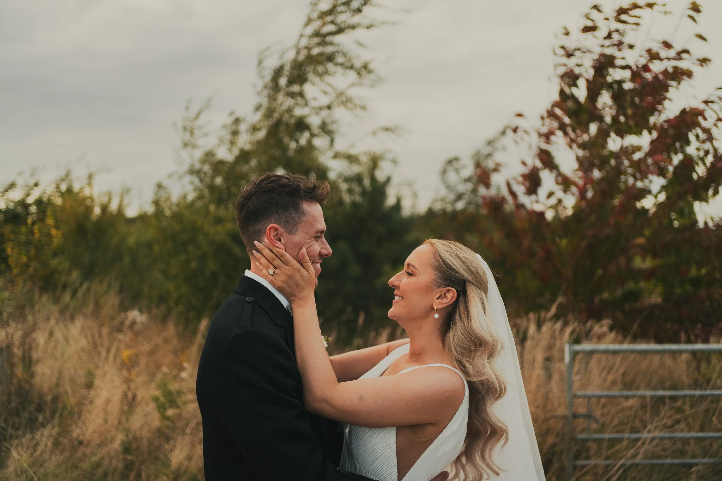 robyn-robbie-falside-mill-wedding-couple-embrace.jpg