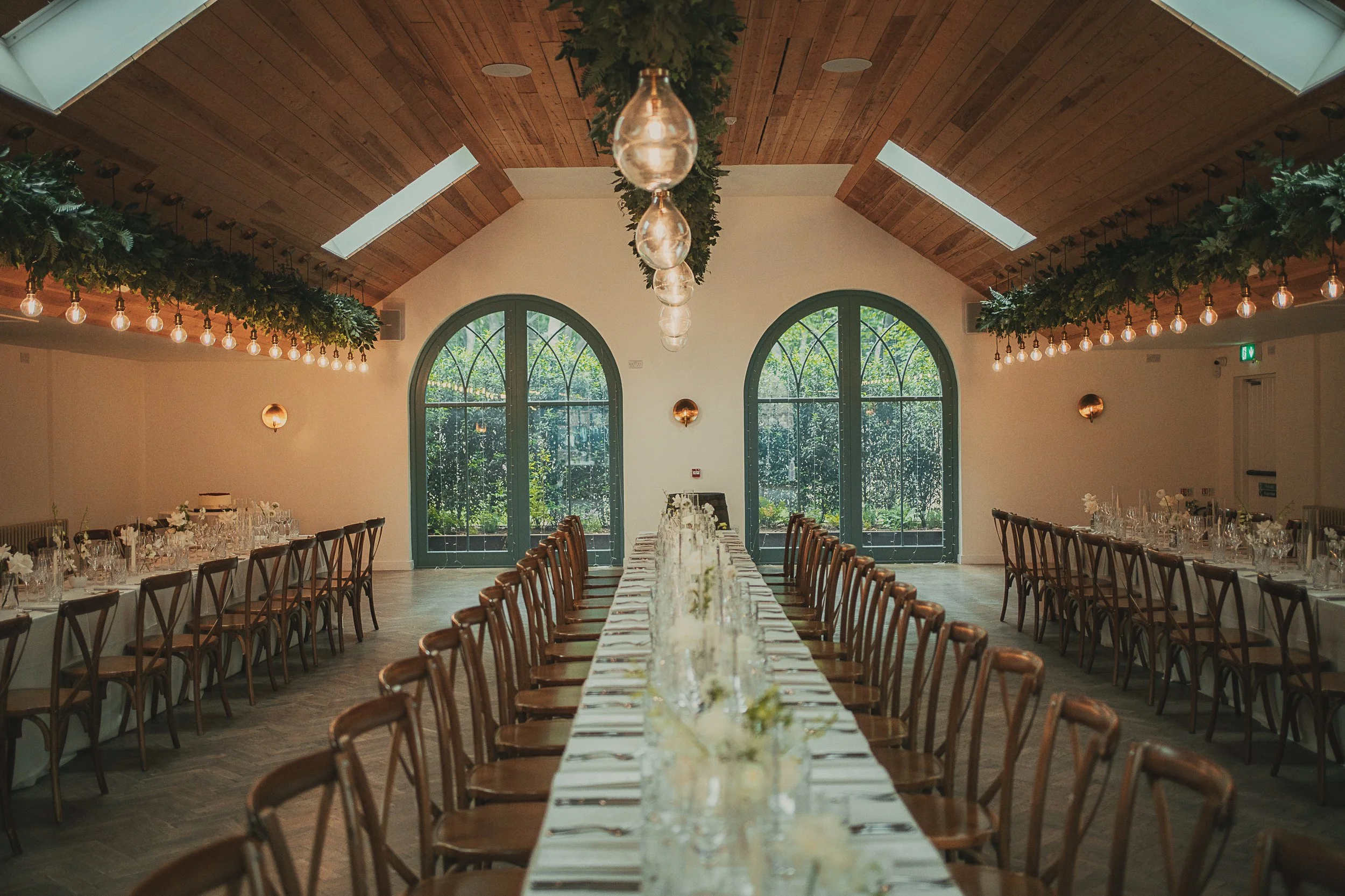 Wedding reception tables prepared inside Broxmouth Courtyard in East Lothian.